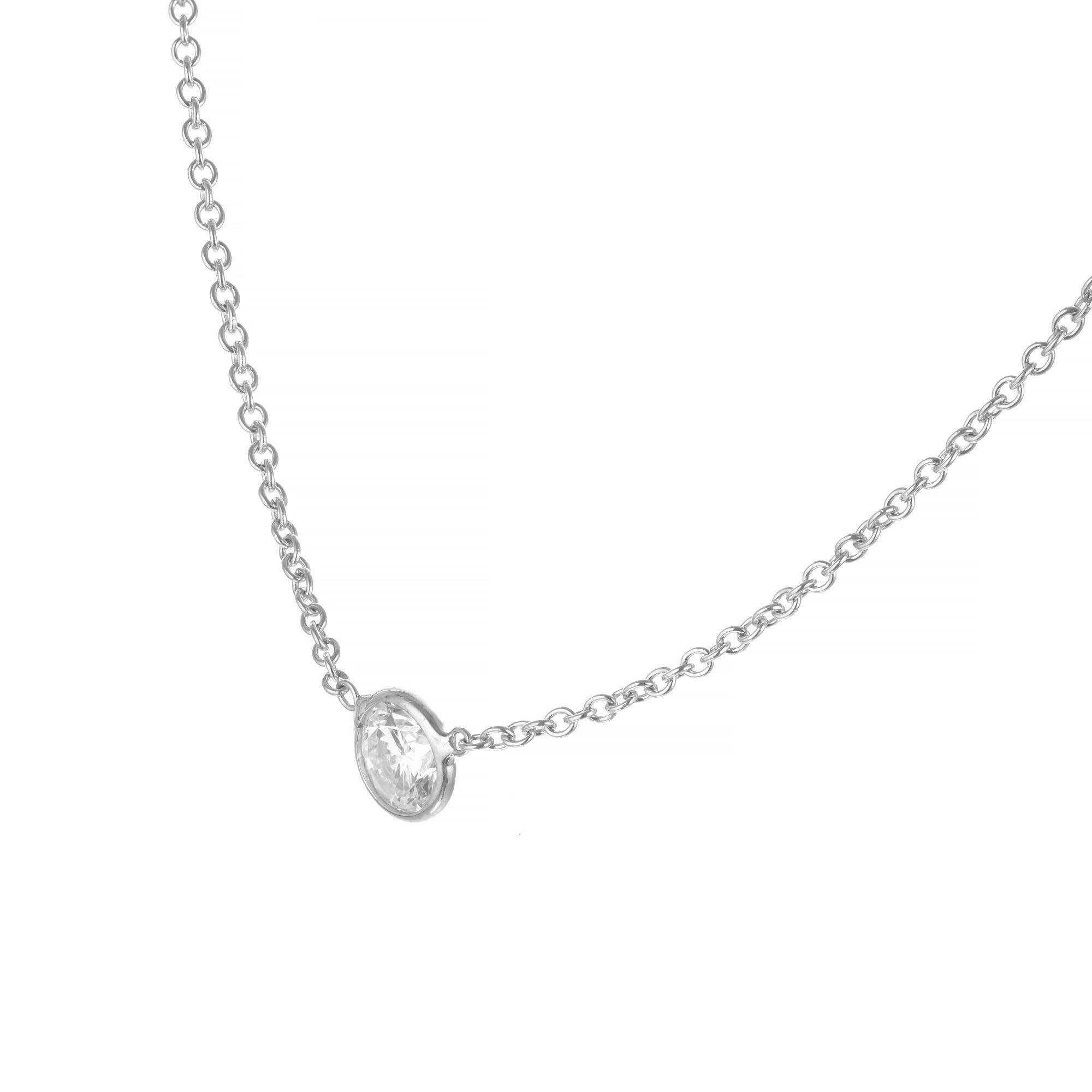 Classic bezel set diamond by the yard style, .50 carat platinum pendant necklace. 16 inch chain. 

1 round brilliant cut diamond, H I approx. .50cts
Platinum
Stamped: PT950
2.7 grams
Top to bottom: 5mm or 3/16 Inch
Width: 5mm or 3/16 Inch
Depth or