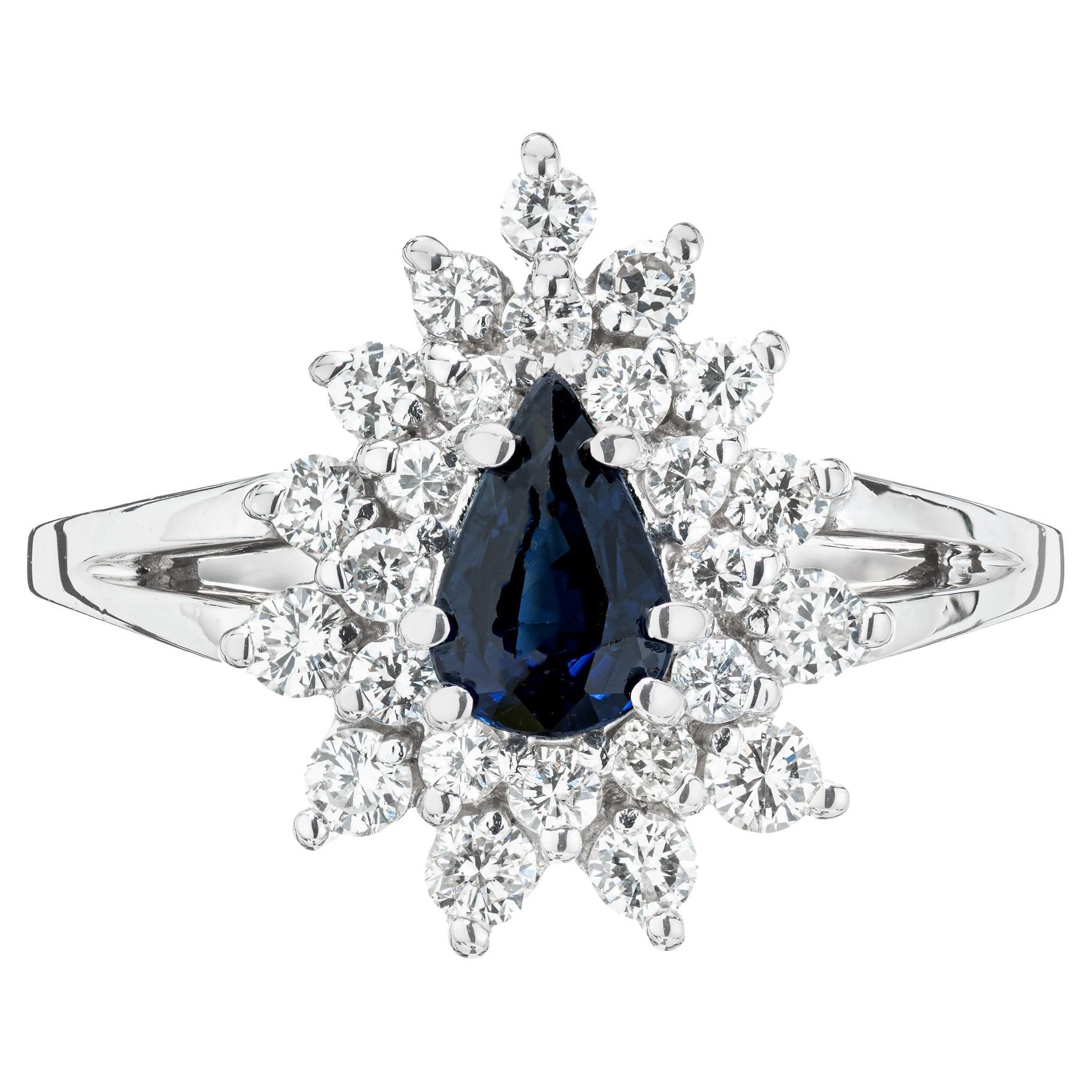 Bague halo en or blanc avec saphir bleu de 0,50 carat et diamants