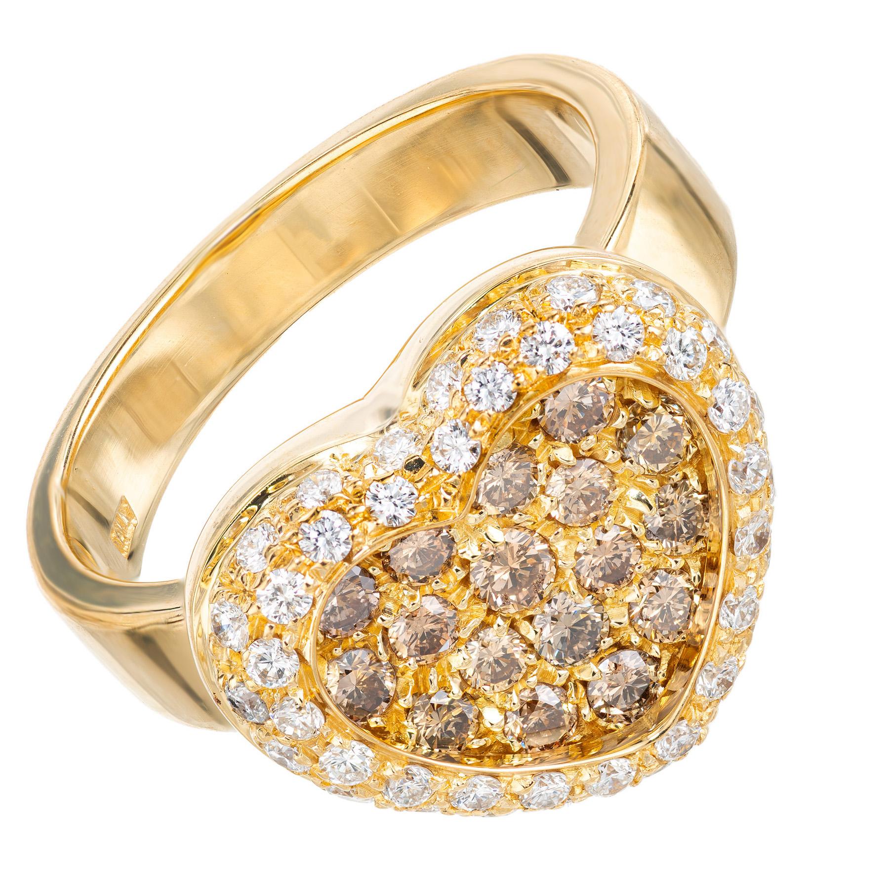 Beautiful well-made diamond heart ring in 18k yellow gold with 17 brown cognac round diamonds accented by a halo of 42 round brilliant cut white diamonds. The contrast from the different color diamonds while being set in yellow gold creates a