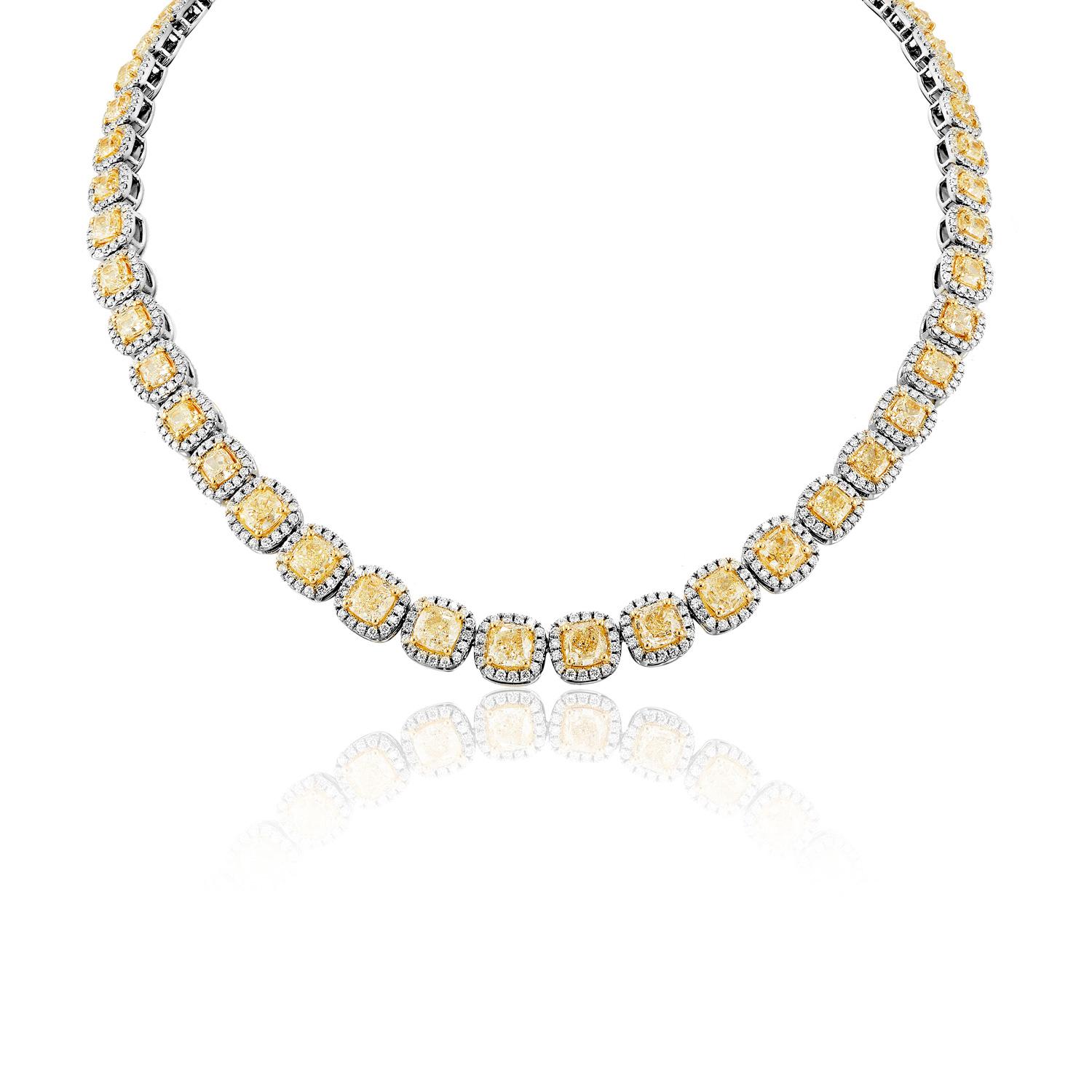 Earth Mined Diamonds:

Carat Weight: 38.52 Carats
Style: Cushion Cut

Halo Diamonds:
Carat Weight: 11.00 Carats
Style: Round Brilliant Cut 
Chains: 18 Karat White and Yellow Gold

Total Carat Weight: 49.52 Carats