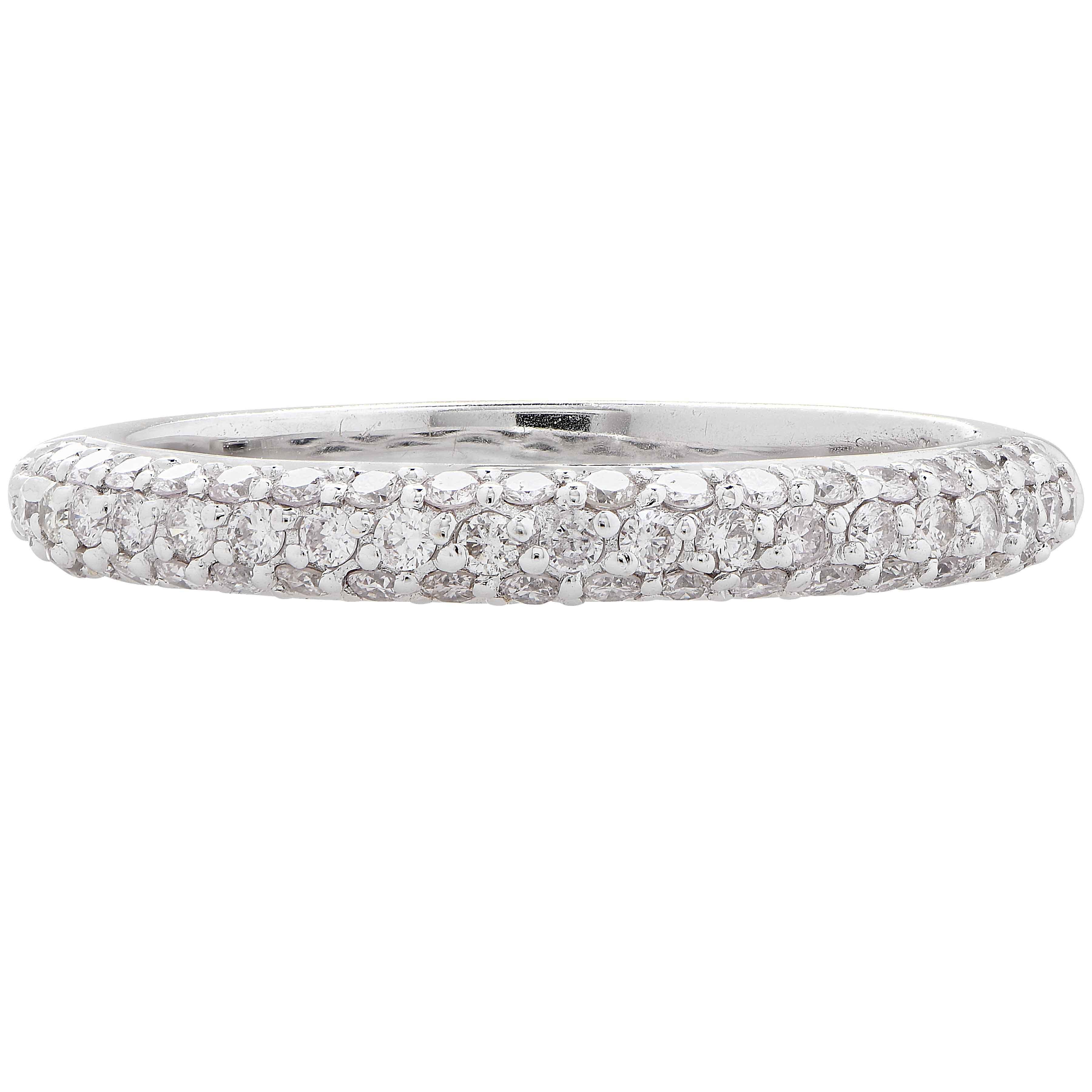 18 Karat White Gold Band features 58 round brilliant cut diamonds with a total weight of .50 carats.
Ring Size: 7
Metal Weight: 3 Grams