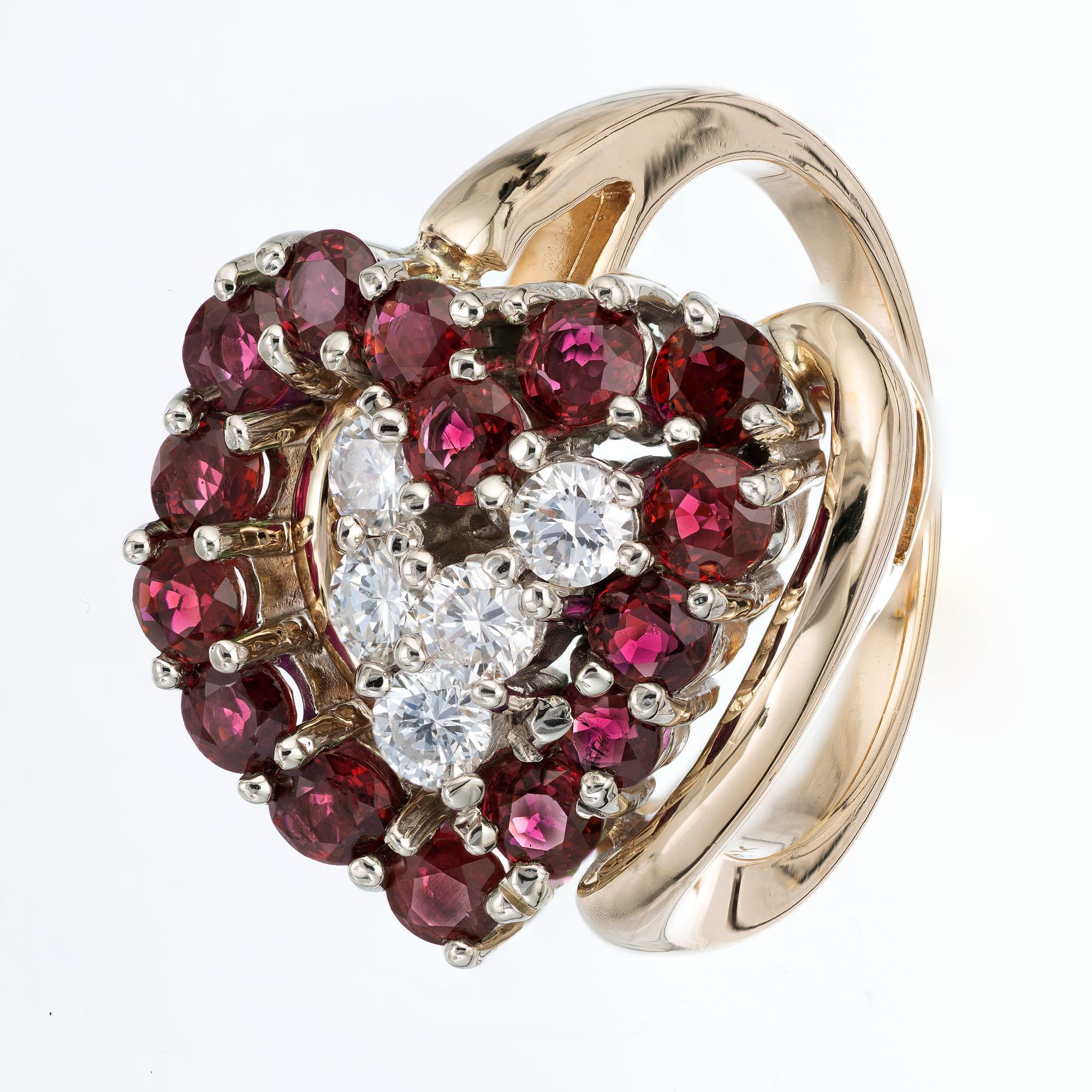 Heart shaped Garnet and Diamond ring. Heart shape on its side design made up of round Garnets with round brilliant cut accent Diamonds, in a 14k yellow gold setting.  

 15 round Rhodolite Garnets, 3.0mm 
 5 round brilliant cut Diamonds, approx.