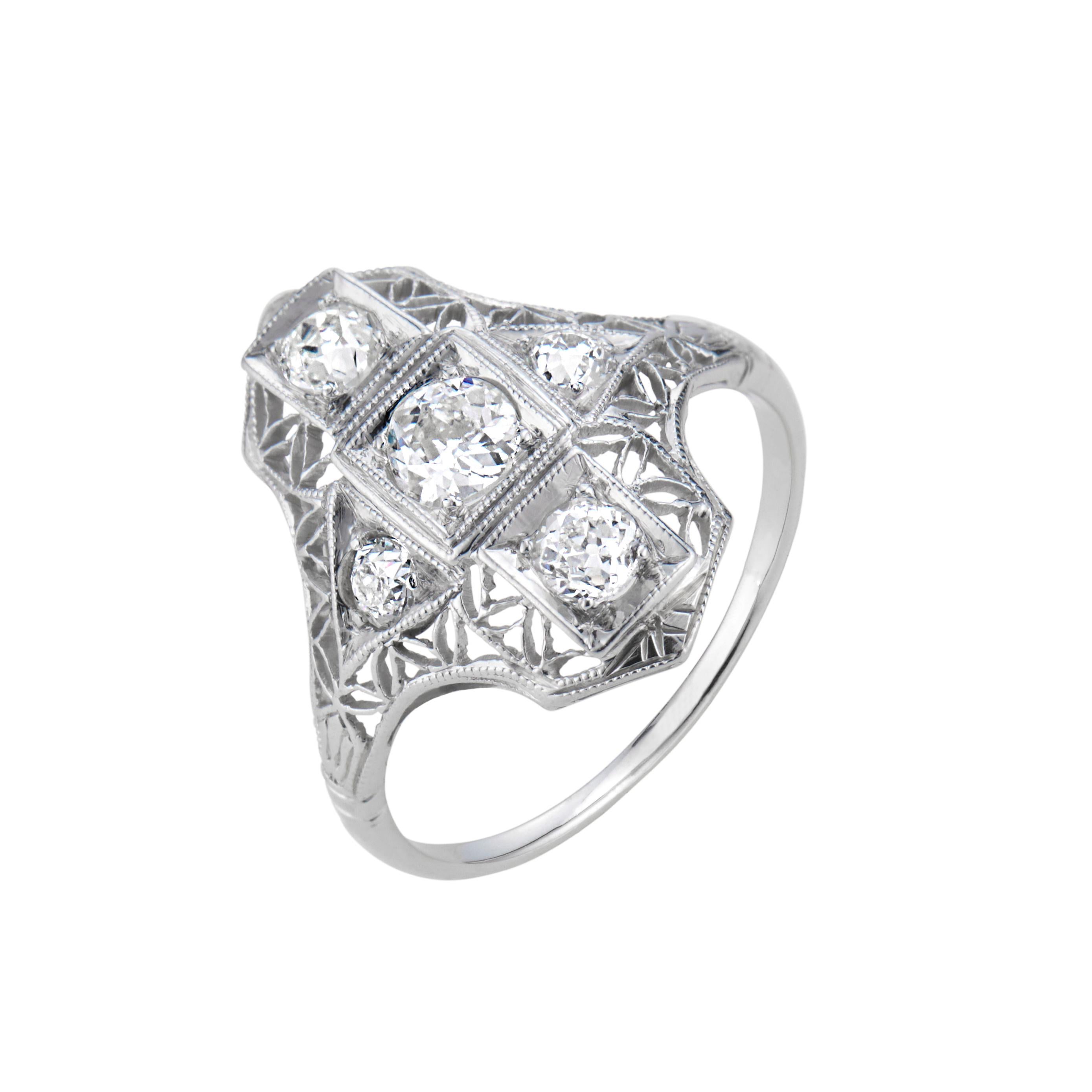 Vintage 1900's Edwardian diamond platinum ring. 5 old mine cut diamonds in a filigree platinum setting. 

5 old mine cut diamonds, G-H-I VS-SI approx. .50cts
Size 5 and sizable 
Platinum 
2.6 grams 
Width at top: 17.4mm
Height at top: 3.5mm
Width at