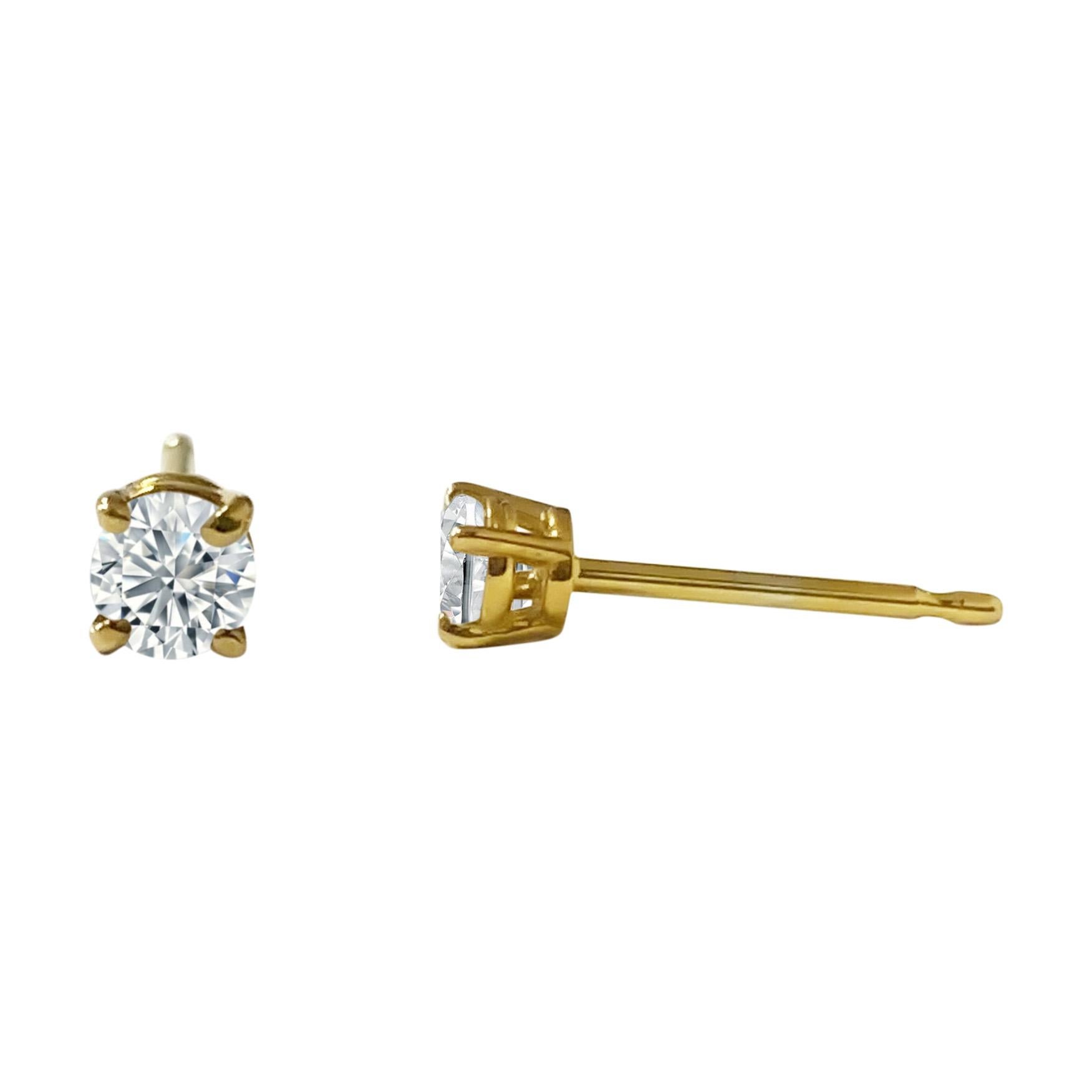 Crafted from lustrous 14k yellow gold, these stunning stud earrings feature sparkling round brilliant cut diamonds totaling 0.50 carats. With a beautiful H color and I1-2 clarity, these diamonds are 100% natural earth mined, adding a touch of