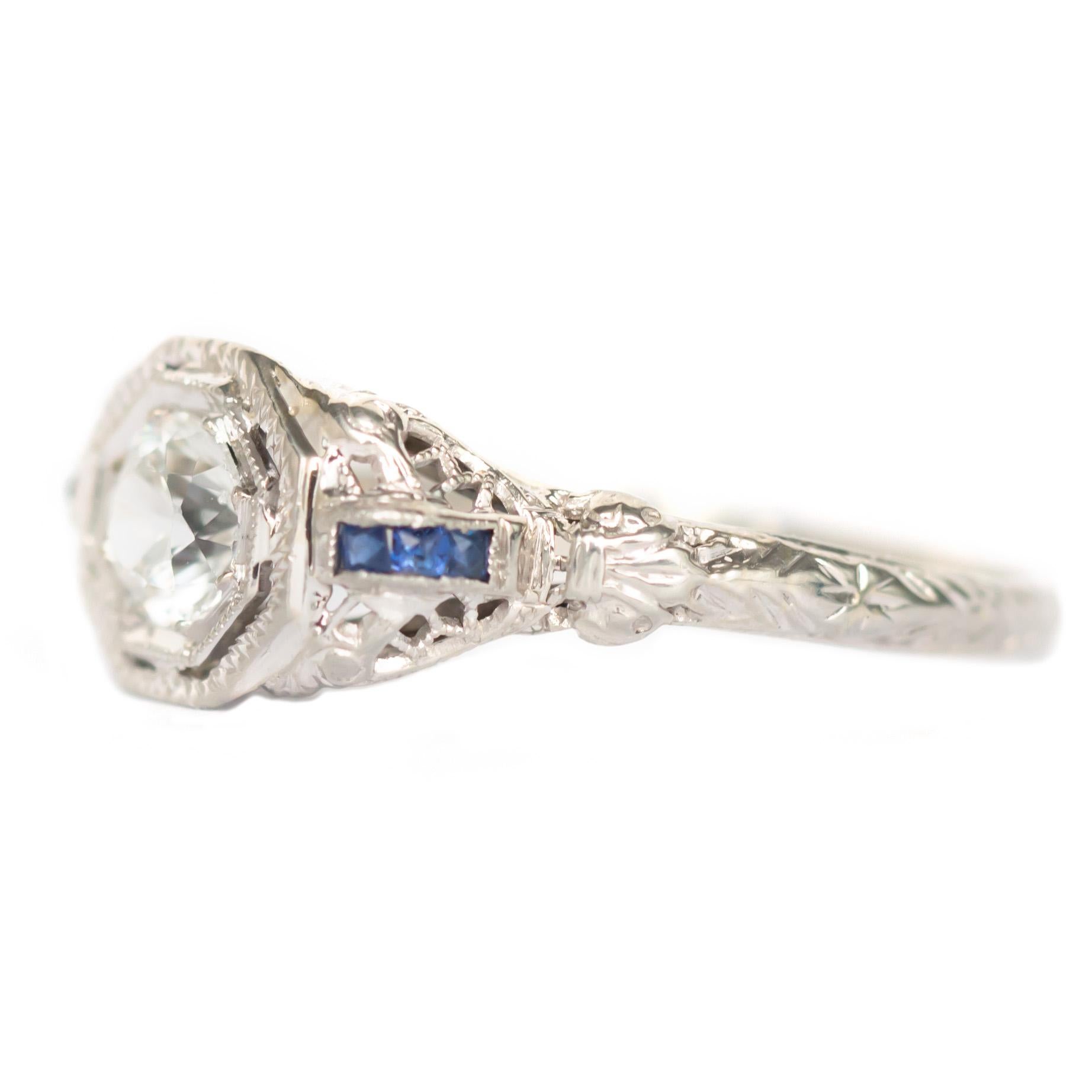 Item Details: 
Ring Size: 8.5
Metal Type: 18 Karat White Gold 
Weight: 2.5 grams

Center Diamond Details
Shape: Old European
Carat Weight: .50 carat
Color: Natural Sapphire

Side Stone Details: 
Type: Sapphire
Shape: French Cut 
Total Carat Weight: