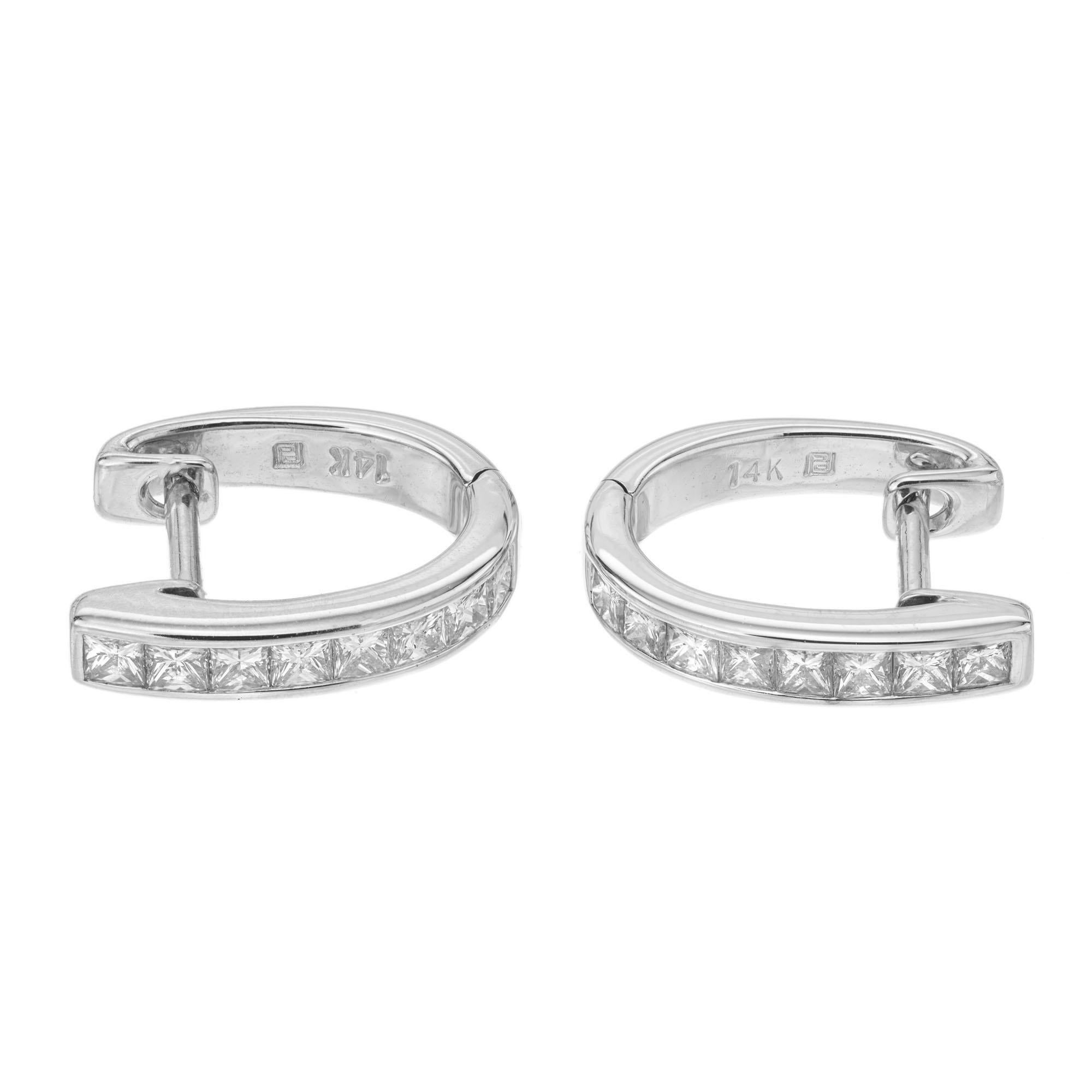 Simple .50 carat princess cut diamond huggie earrings in 14k white gold.

16 princess cut diamonds, H-I VS approx. .50cts
14k white gold 
Stamped: 14k
2.4 grams
Top to bottom: 13.4mm or .5 Inch
Width: 2.8mm or 1/8 Inch
Depth or thickness: 1.8mm 
