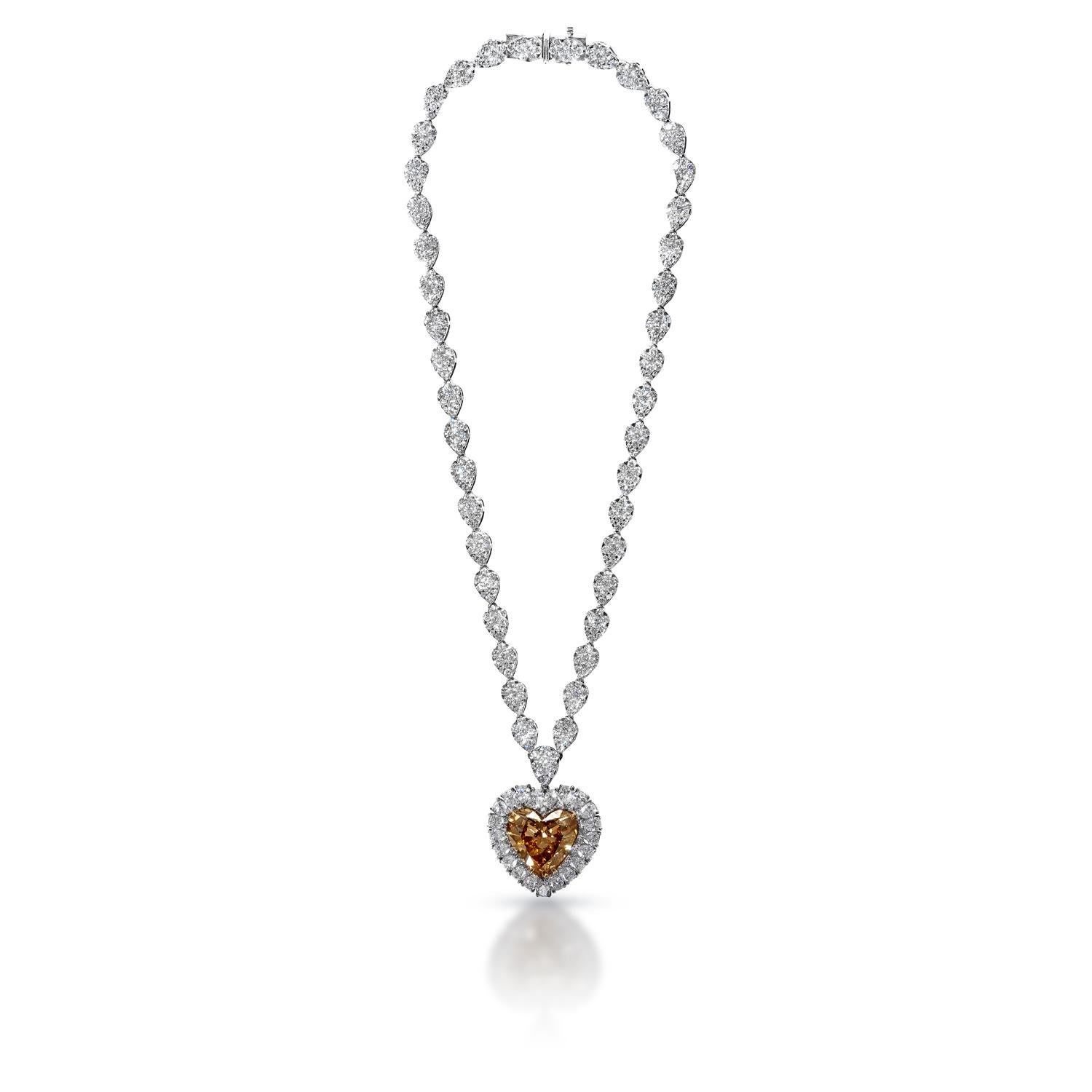 This stunning diamond necklace, inspired by the iconic one from James Cameron's Titanic movie, will have you feeling like the belle of the ball. The pendant is a heart shaped diamond swing and boasts 20 carats of a stunningly fancy brown hue. 29