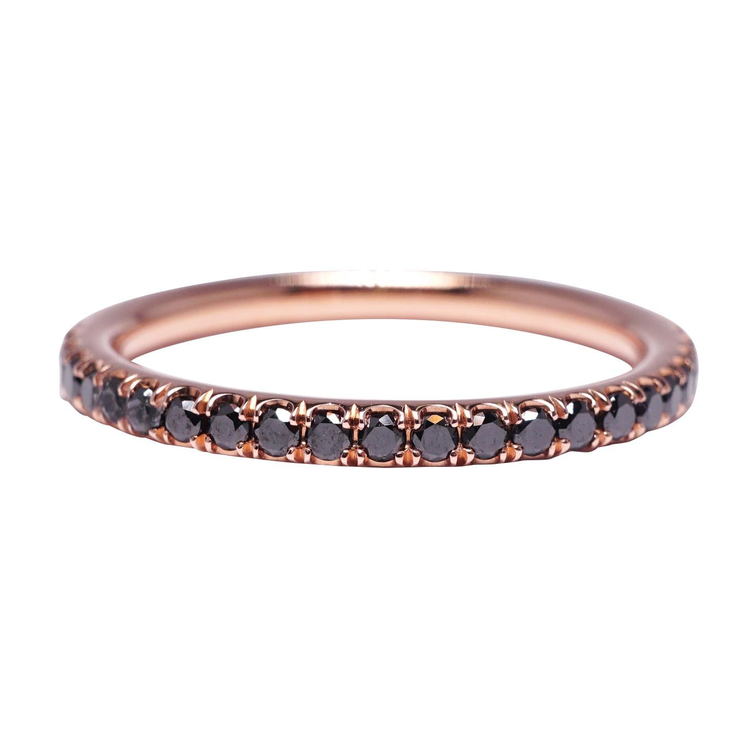 Black Diamond eternity wedding band set in 14K Rose gold. Pave set brilliant round diamonds are natural black. Carat weight: .50 ct. Total ring weight: 1.50 grams. Ring size: 5.25. Can be sized upon request. This ring is customizable, price may vary