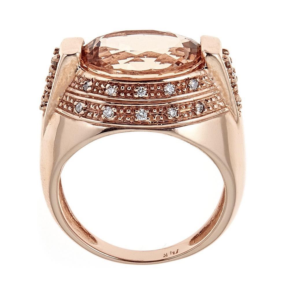 Handcrafted in 14K rose gold, this ring features a 5 carat morganite with round brilliant diamonds.