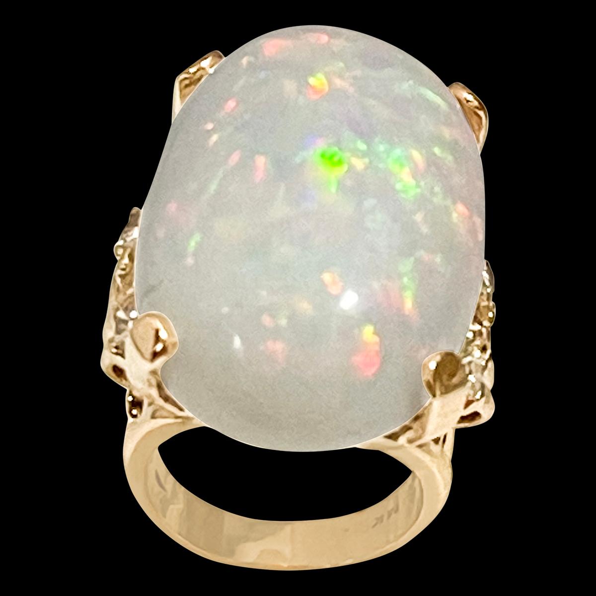 approximately 50  Carat Oval Shape Ethiopian Opal & Diamond  Cocktail Ring 14 Karat Yellow Gold
Oval  Natural Opal  A classic, Cocktail ring 
14 Karat Yellow  Gold Estate
Ring size 7
3 Round brilliant cut diamonds approximately on each side of the