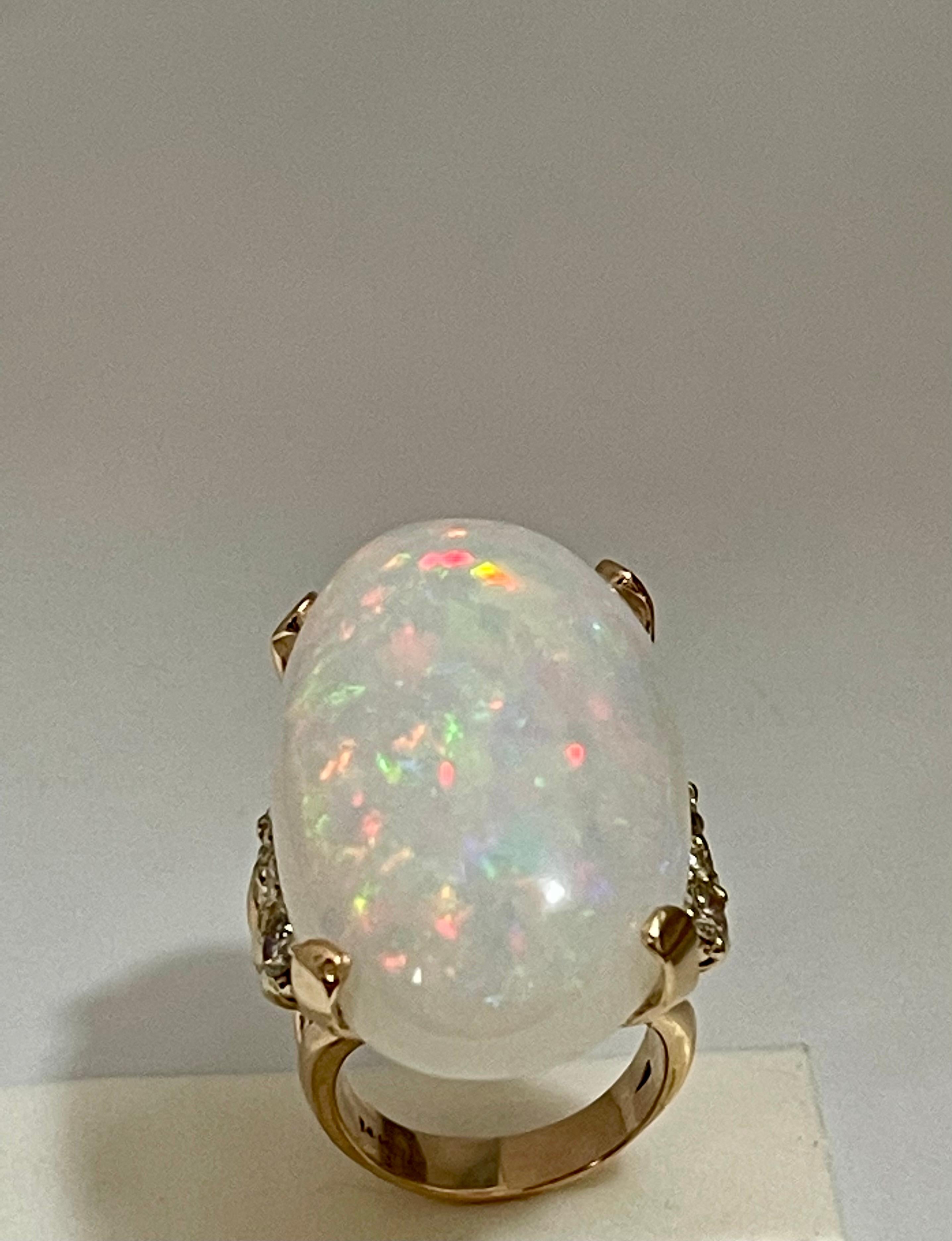 50 Carat Oval Shape Ethiopian Opal & Diamond Cocktail Ring 14 Karat Yellow Gold In Excellent Condition In New York, NY