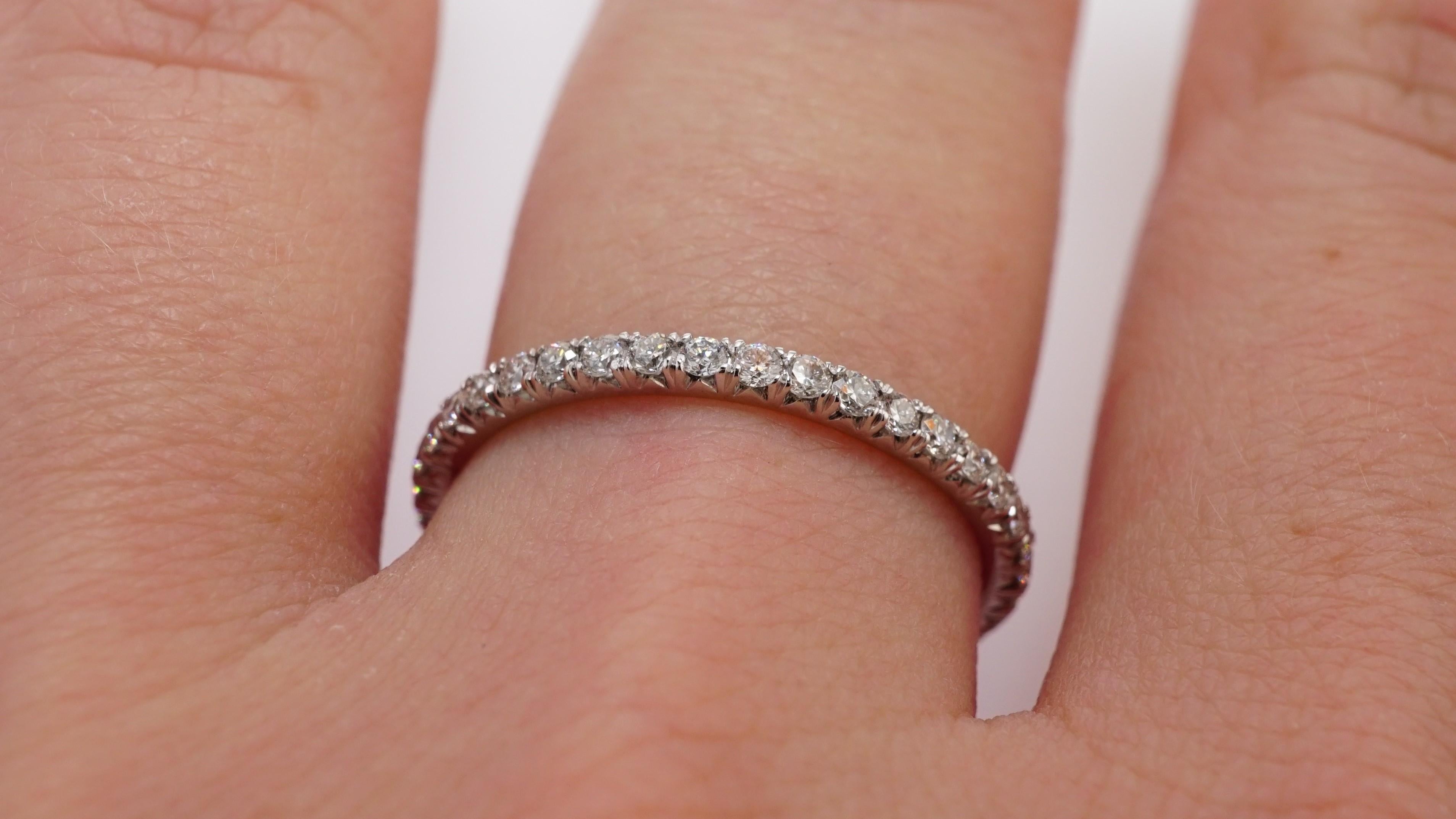 Diamond Eternity Wedding Band set in Platinum. Pave set brilliant round diamonds are F-G VS2. Carat weight = .50 ct. Total ring weight 1.90 grams. 
Ring size 5.75. Can be sized upon request. This ring is customizable, price may vary depending on