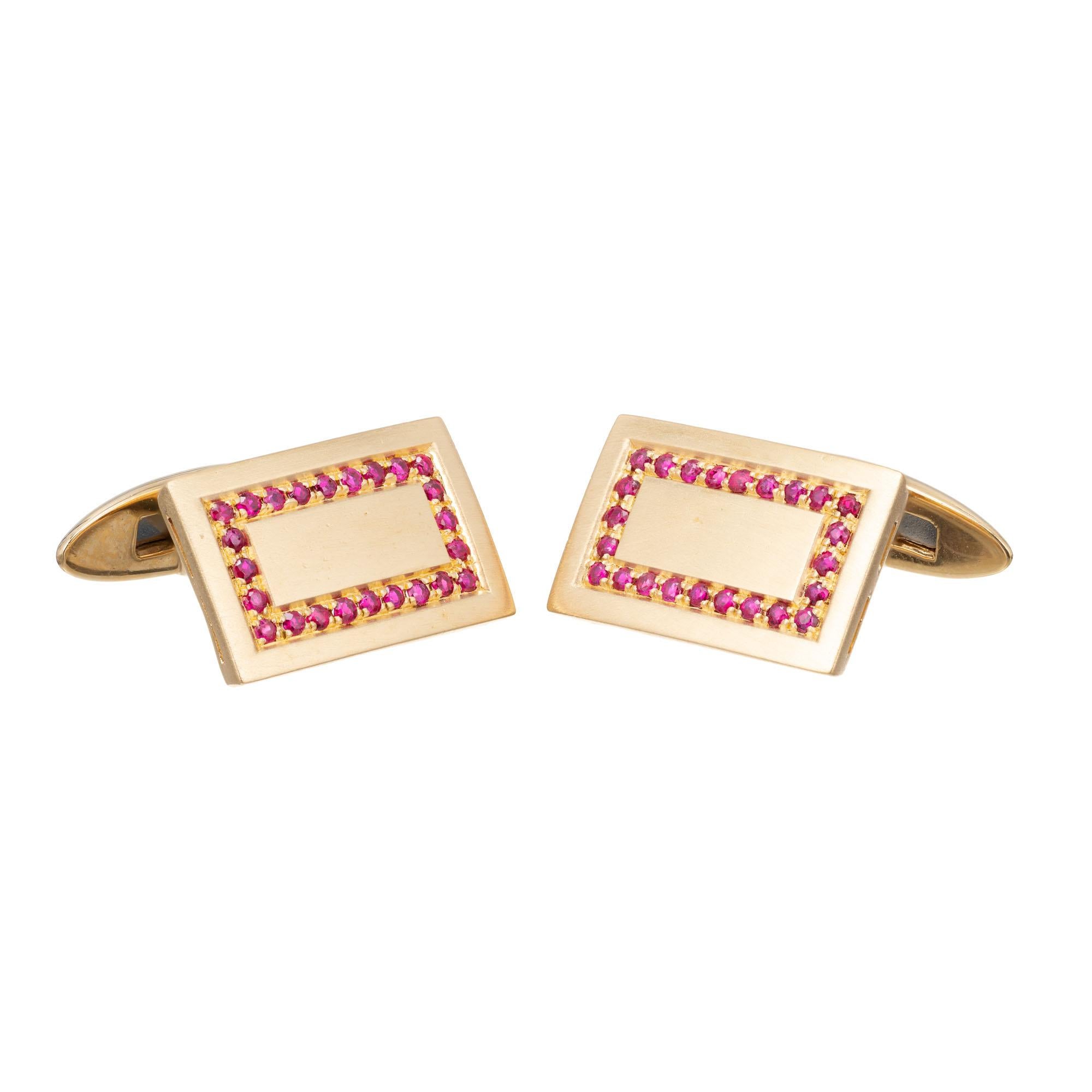 Brushed 18k yellow gold cufflinks with a halo of red rubies on each cufflink.

48 round red rubies, approx. .50cts
18k yellow gold
Stamped: 750
15.6 grams
Top to bottom: 19.54mm or ¾ Inch
Width: 12.82mm or ½ Inch
Depth or thickness: 2.9mm




