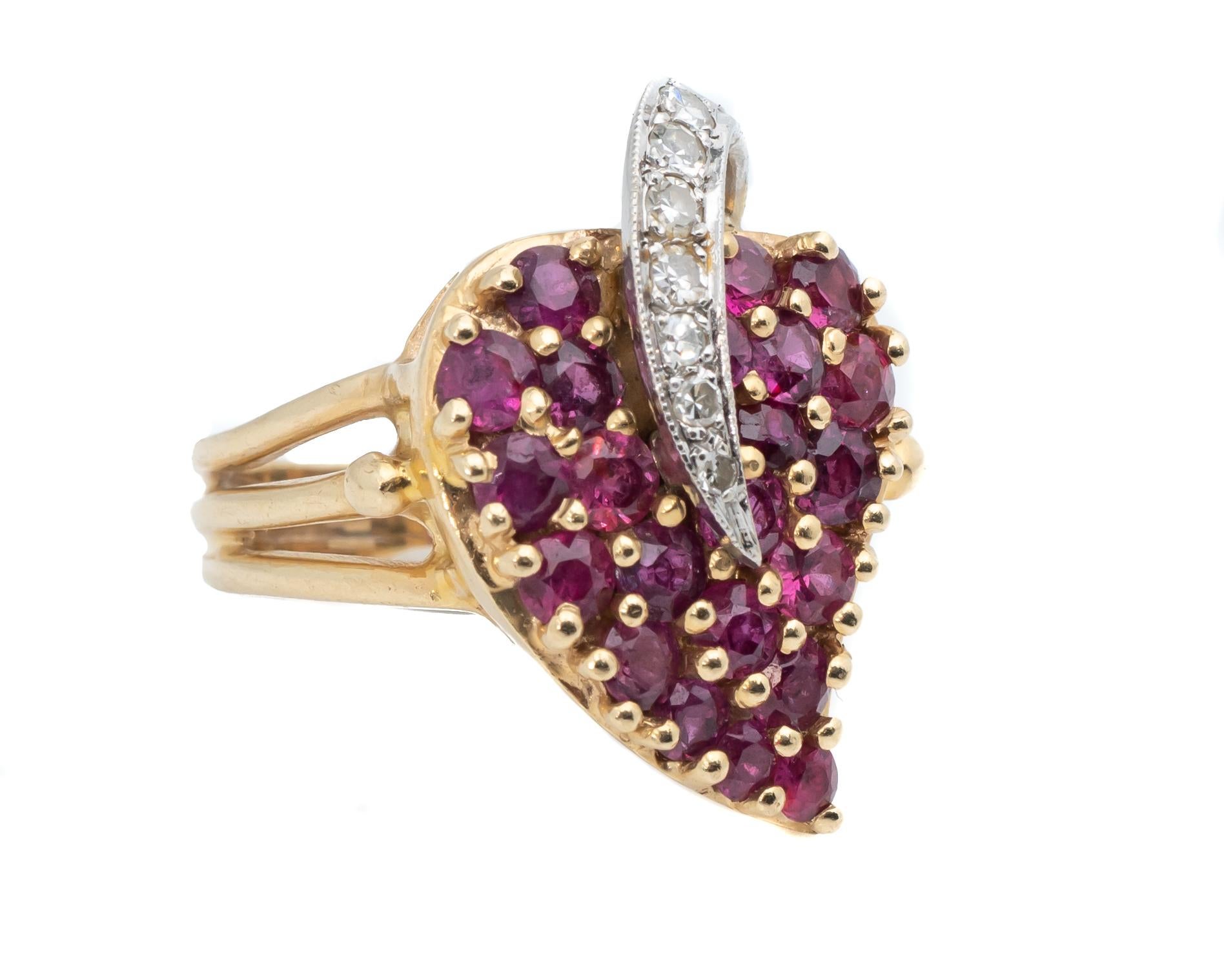 14 Karat Yellow Gold Ring featuring a heart shape display of rubies and accent diamonds
The ring also features a split shank (three row) on the sides tapering down into one a wide shank

Ring Details:
Gold: 14 Karat Yellow Gold (hallmarked)
Weight: