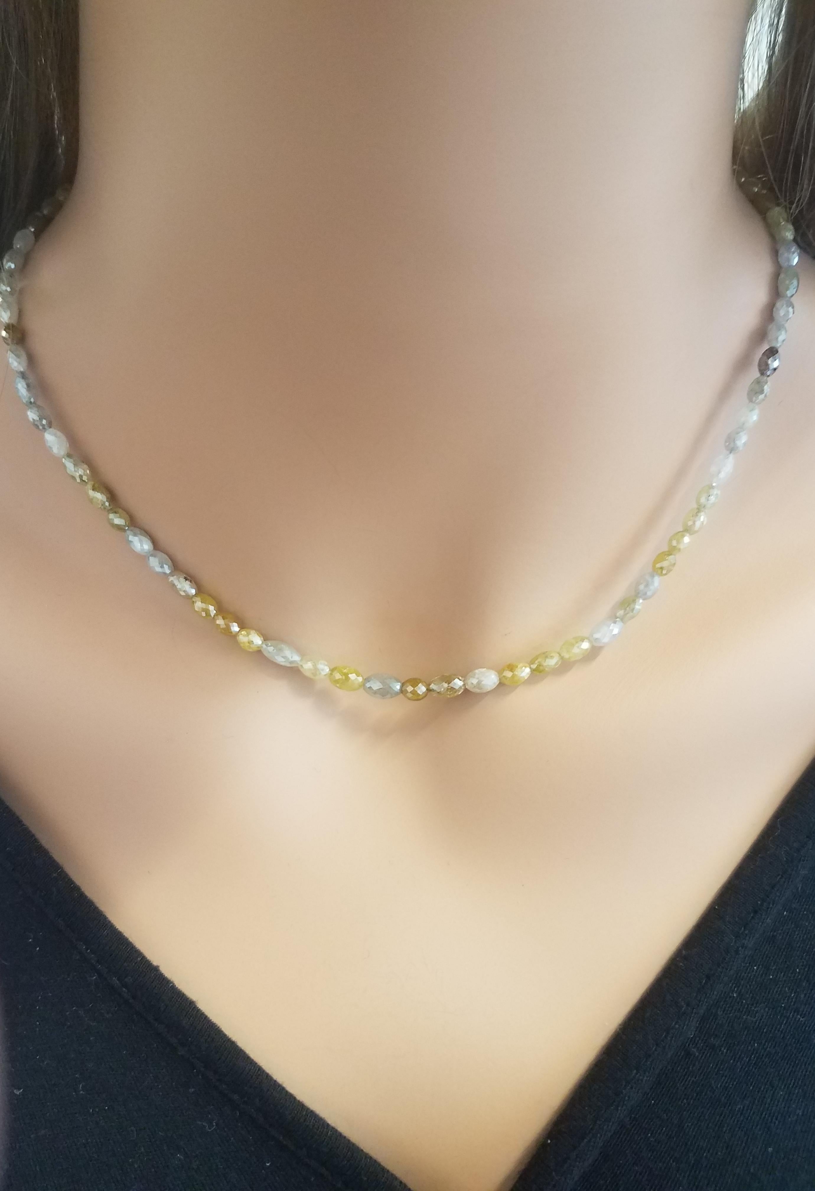 The 14K Yellow Gold setting will give the necklace a warm, classic look, and the 50.00 CTW of multi-color briolette diamonds would make for a stunning and vibrant piece. The 81 stones suggest that each diamond may be smaller, but together they