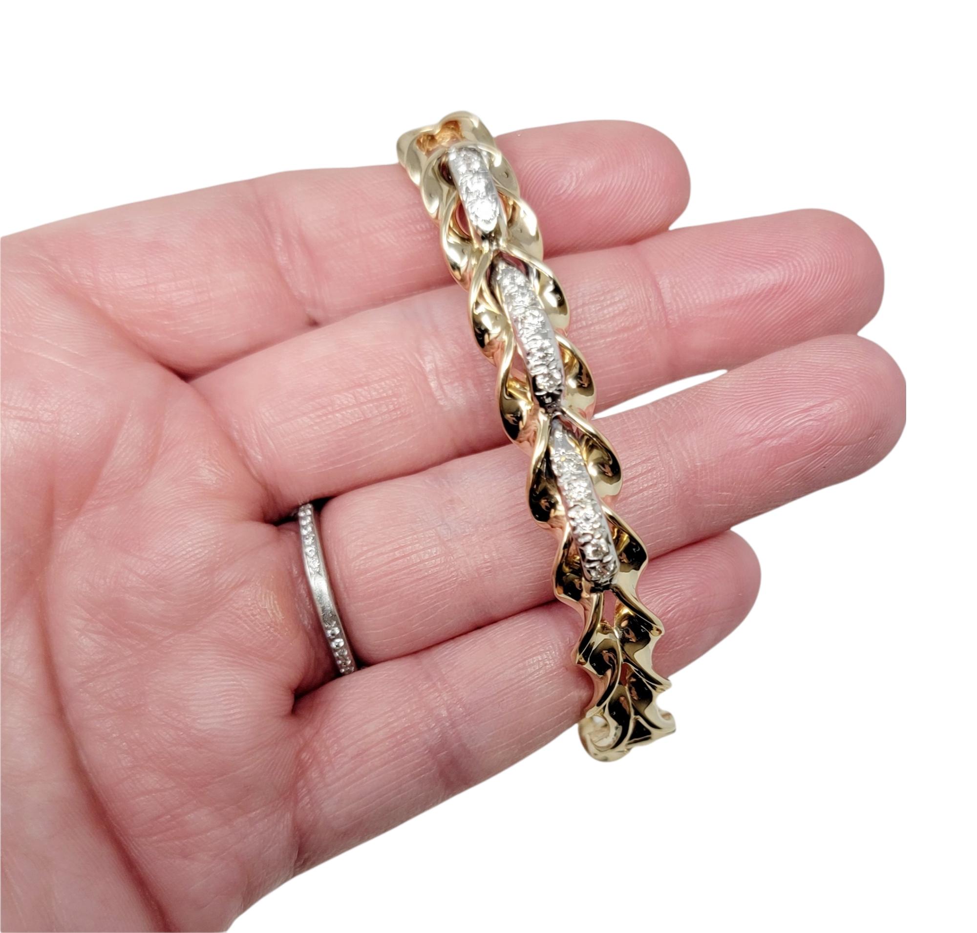 .50 Carat Total Round Diamond Twisted Hinged Bangle Bracelet in Yellow Gold For Sale 1