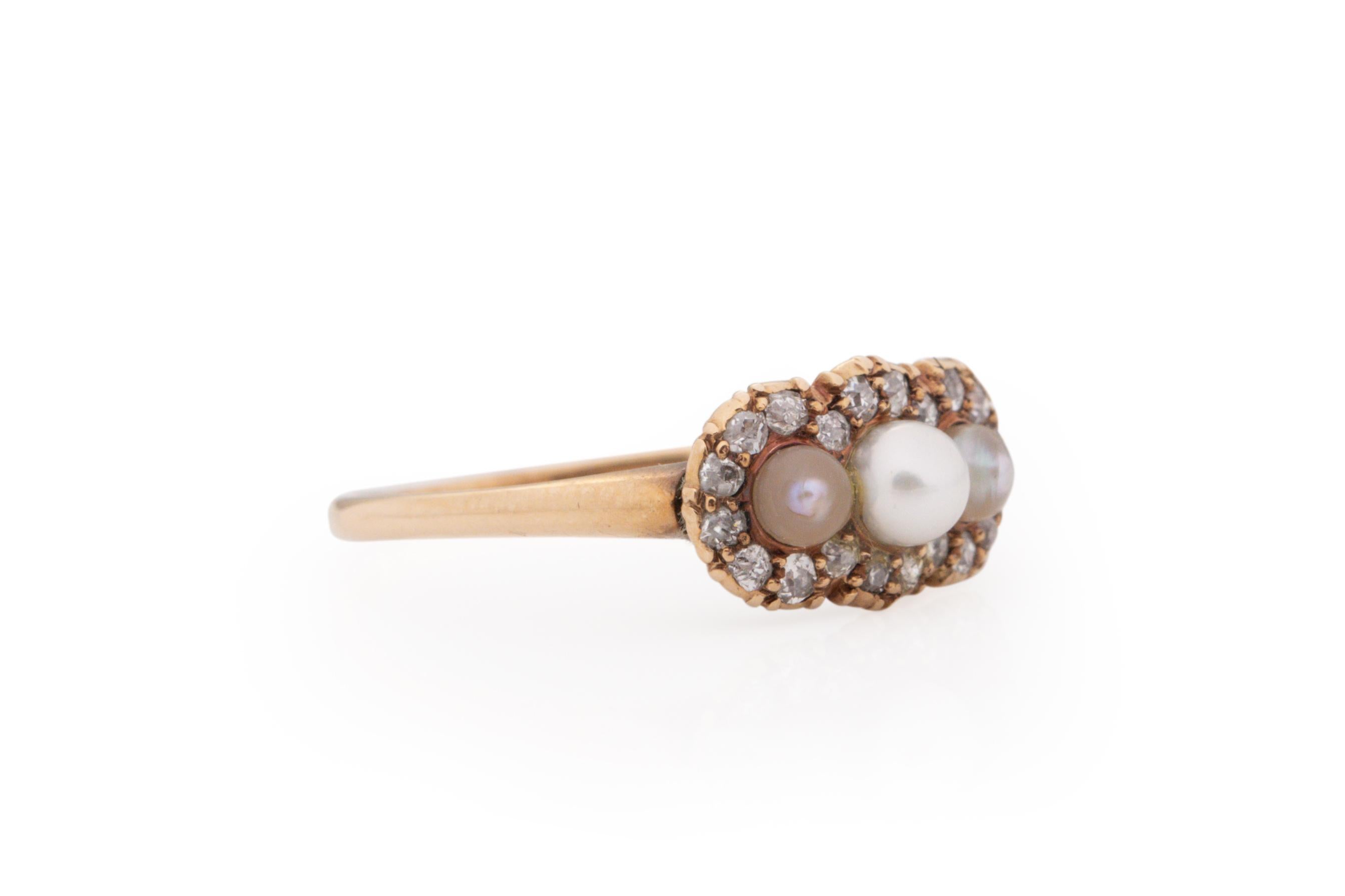 Ring Size: 8
Metal Type: 14 Karat Yellow Gold [Hallmarked, and Tested]
Weight: 2.0 grams

Center Details:
Pearls, Natural
.75 carat, total weight

Side Diamond Details:
Weight: .50 carat total weight
Cut: Antique European Cut
Color: J/K
Clarity: