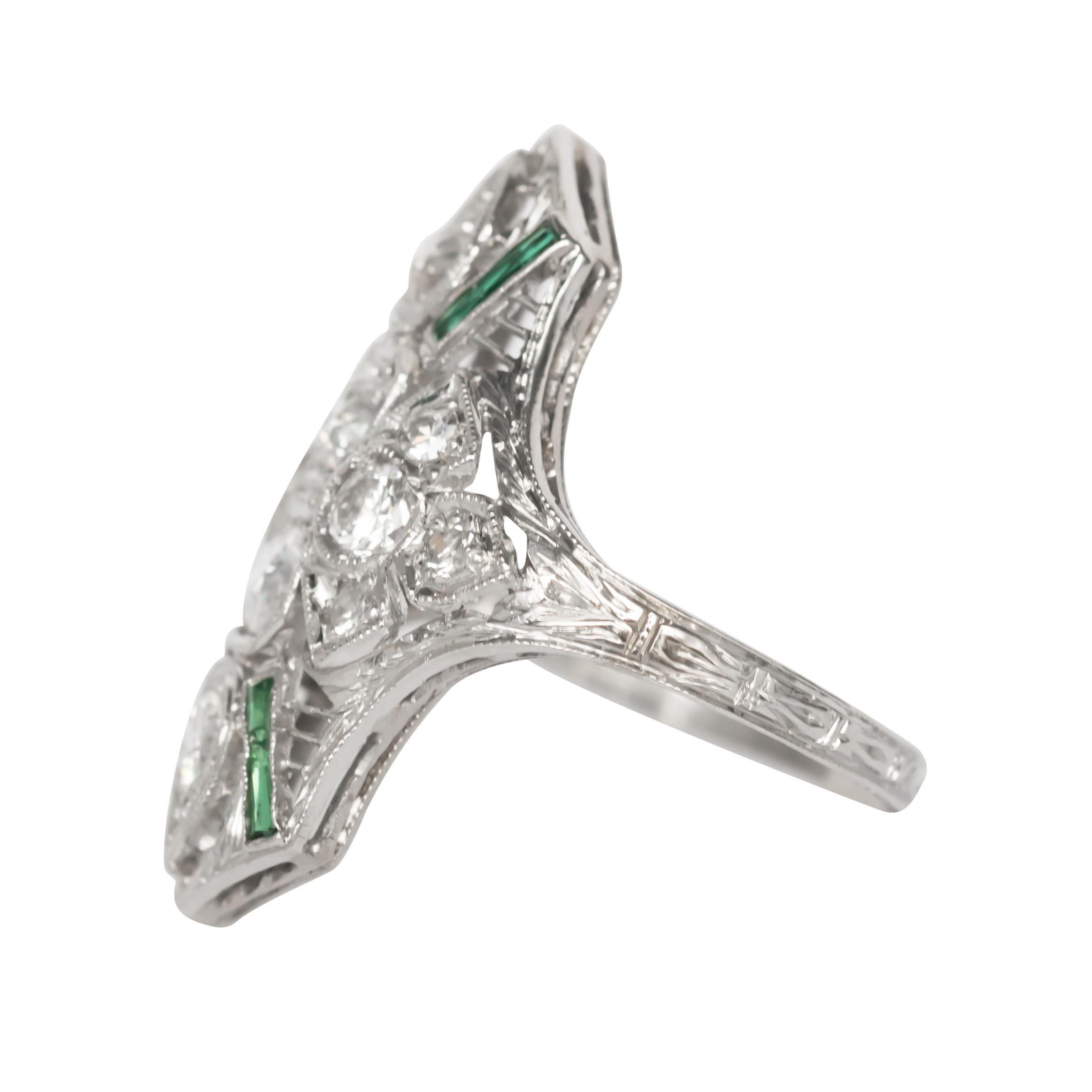 Ring Size: 6.5
Metal Type: Platinum 
Weight: 6.4 grams

Center Diamond Details
Shape: Old European Brilliant 
Total Carat Weight: .50 carat, total weight
Color: F
Clarity: VS

Color Stone Details: 
Type: Synthetic Emerald 
Shape: French Cut 
Total