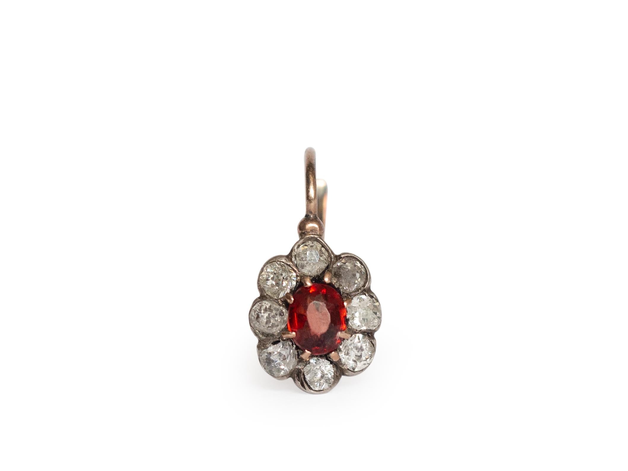 Metal Type: 14K Rose Gold [Hallmarked, and Tested]
Weight:  4.5  grams
Measurements: 9.5 x 6mm

Center Garnet Details:
Weight: .50 carat, total weight
Cut: Old Mine Cushion
Color: Red
Clarity: VS

Side Diamond Details:
Weight: .50 carat, total