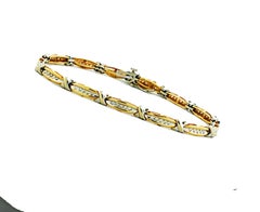 .50 Quilates "X" Pulsera Estilo Kiss Link con Diamantes 14 Kilates 2-Tonos