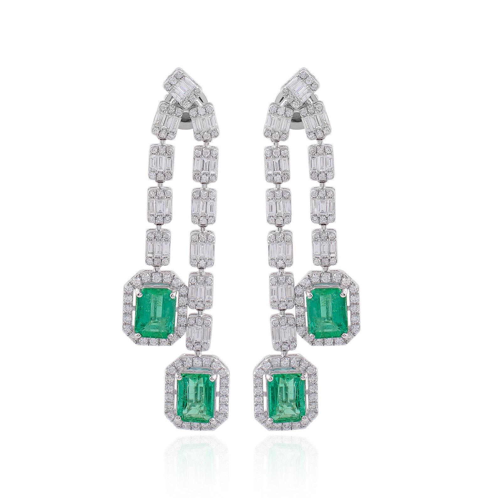 Cast in 14 karat gold, these exquisite earrings are hand set with 5.0 carats emerald and 3.40 carats of glimmering diamonds. 

FOLLOW MEGHNA JEWELS storefront to view the latest collection & exclusive pieces. Meghna Jewels is proudly rated as a Top