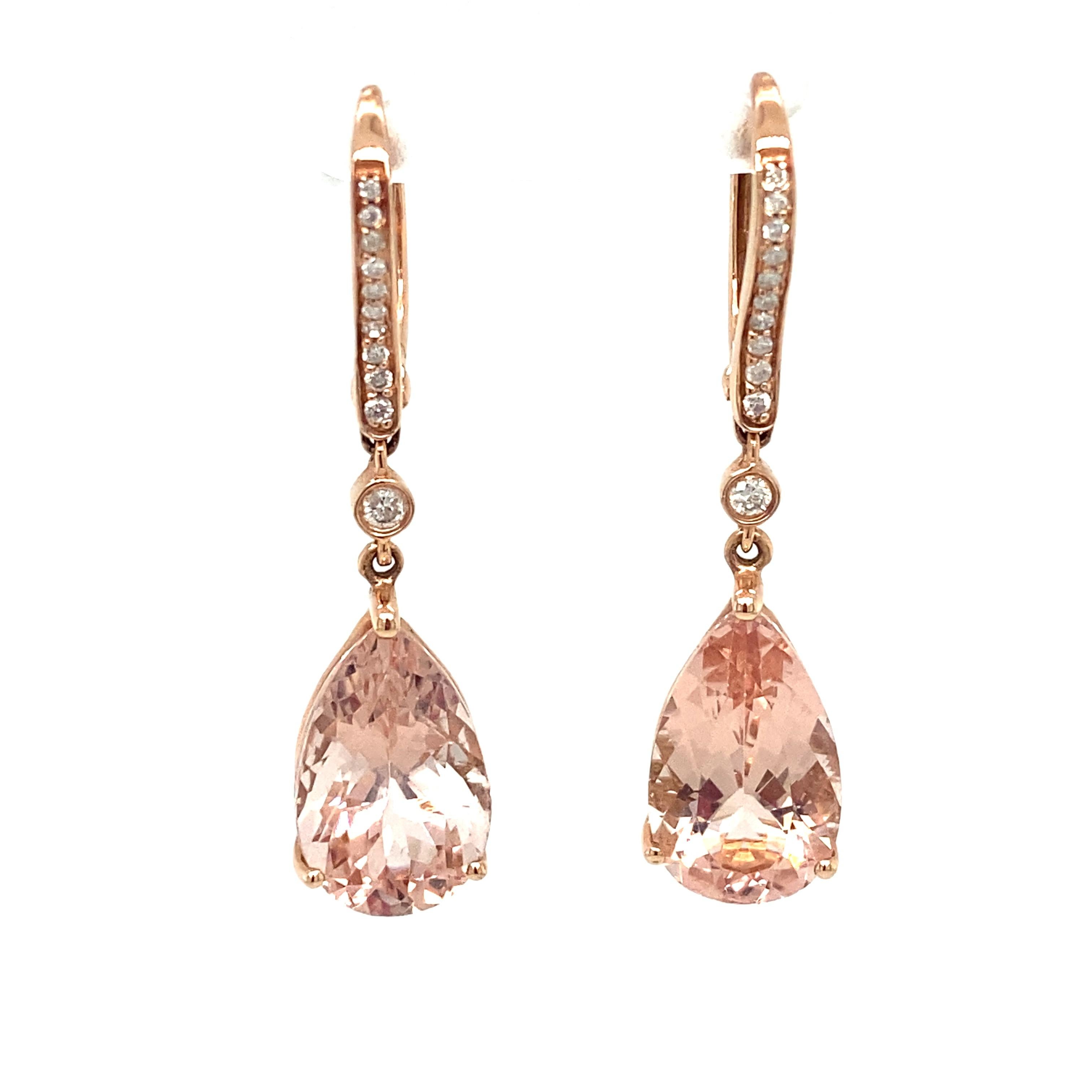 Item Details: These earrings feature beautiful pink pear cut morganites with accent diamonds.

Circa: 2000s
Metal Type: 14k rose gold
Weight: 5.7g
Size: 1.5in L

Diamond Details:

Carat: 0.30 carat total weight
Shape: Round
Color: G
Clarity: