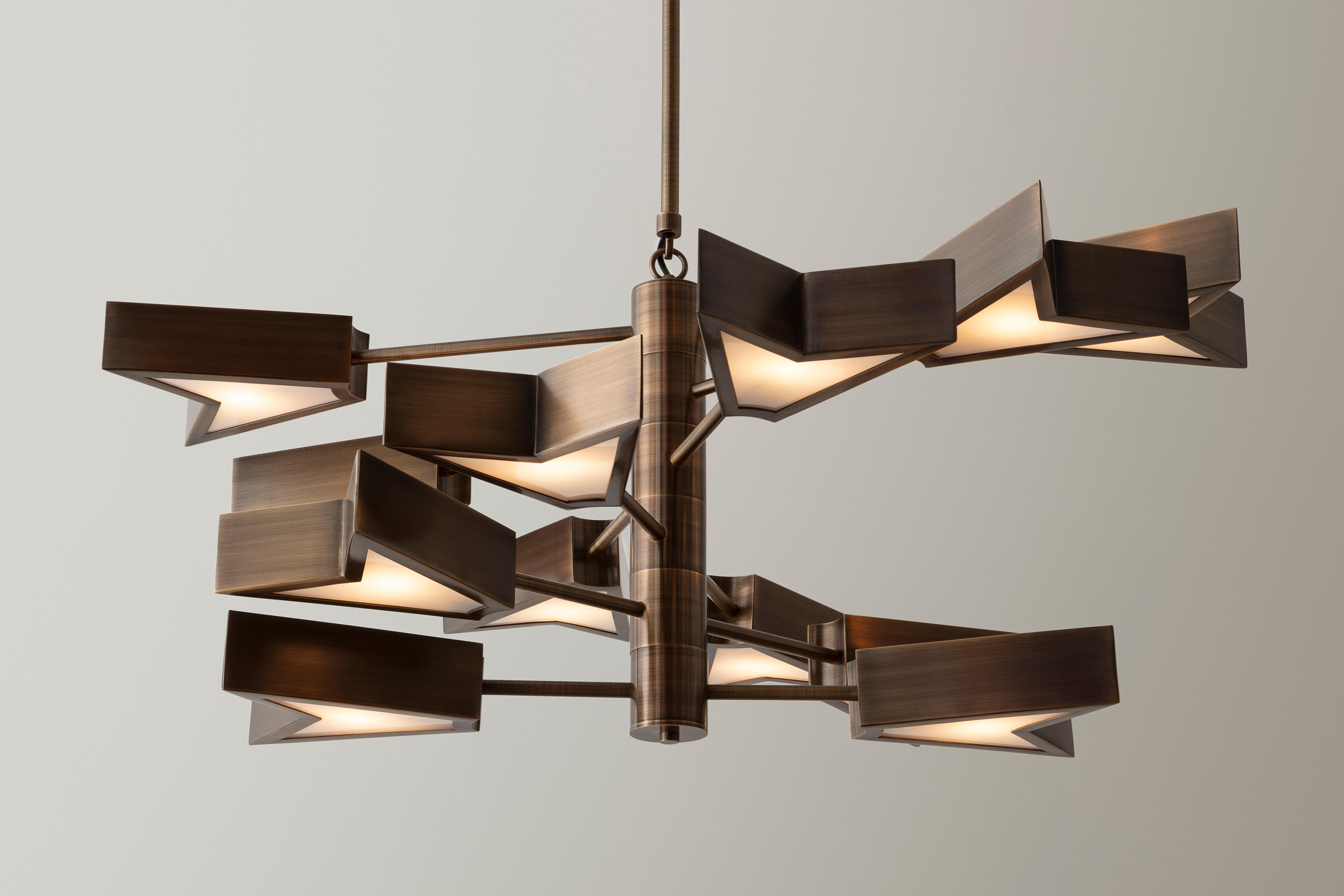 50% Deposit

The Osiris chandelier 6.12 is a modular lighting fixture made from hand formed brass components. Using a small kit of parts, many unique designs can be fabricated. The brass fixture body is offered in six artisanal finishes. Soft