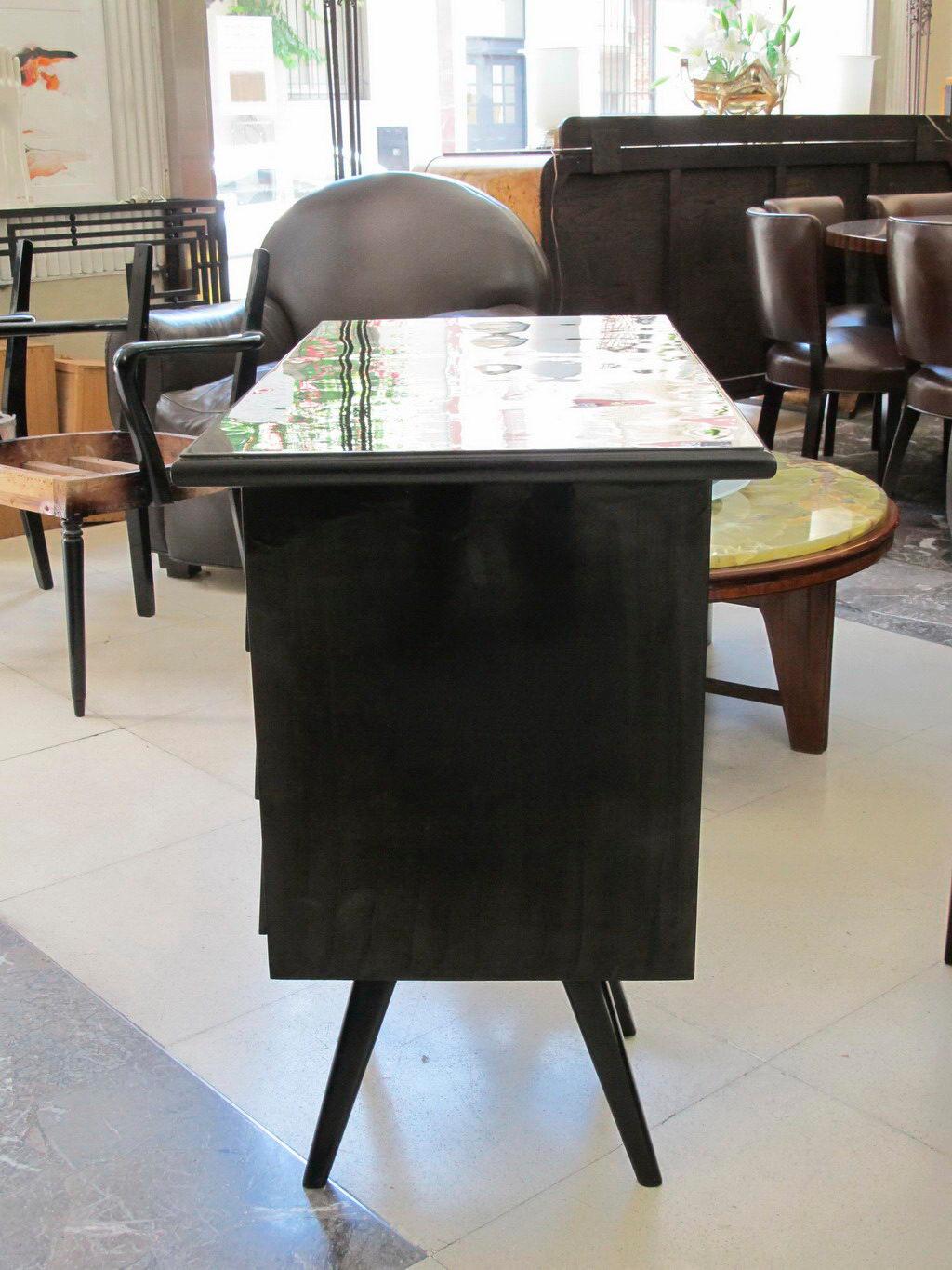 Wood desk from the 50s, Italian.

Desk 1950s 
Country: Italian
Finish: polyurethanic lacquer
It is an elegant and sophisticated desk.
We have specialized in the sale of Art Deco and Art Nouveau and Vintage styles since 1982. If you have any