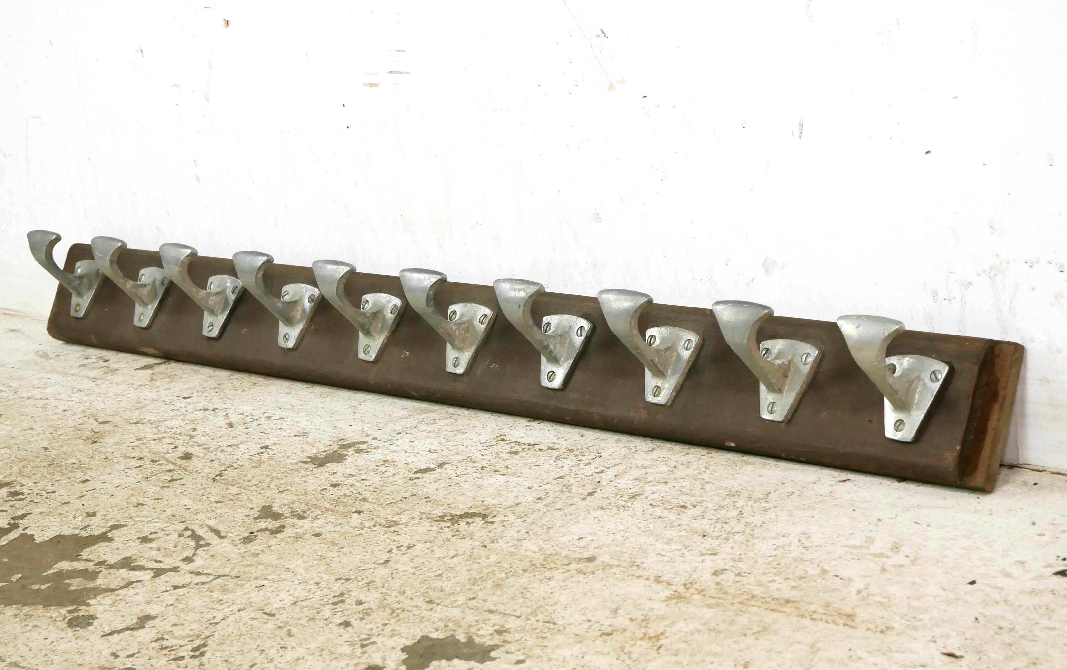 European dark tone wooden back rack with ten aluminum single arm hooks. Good condition with surface wear from age. One available. Please note, this item is located in our NYC location.