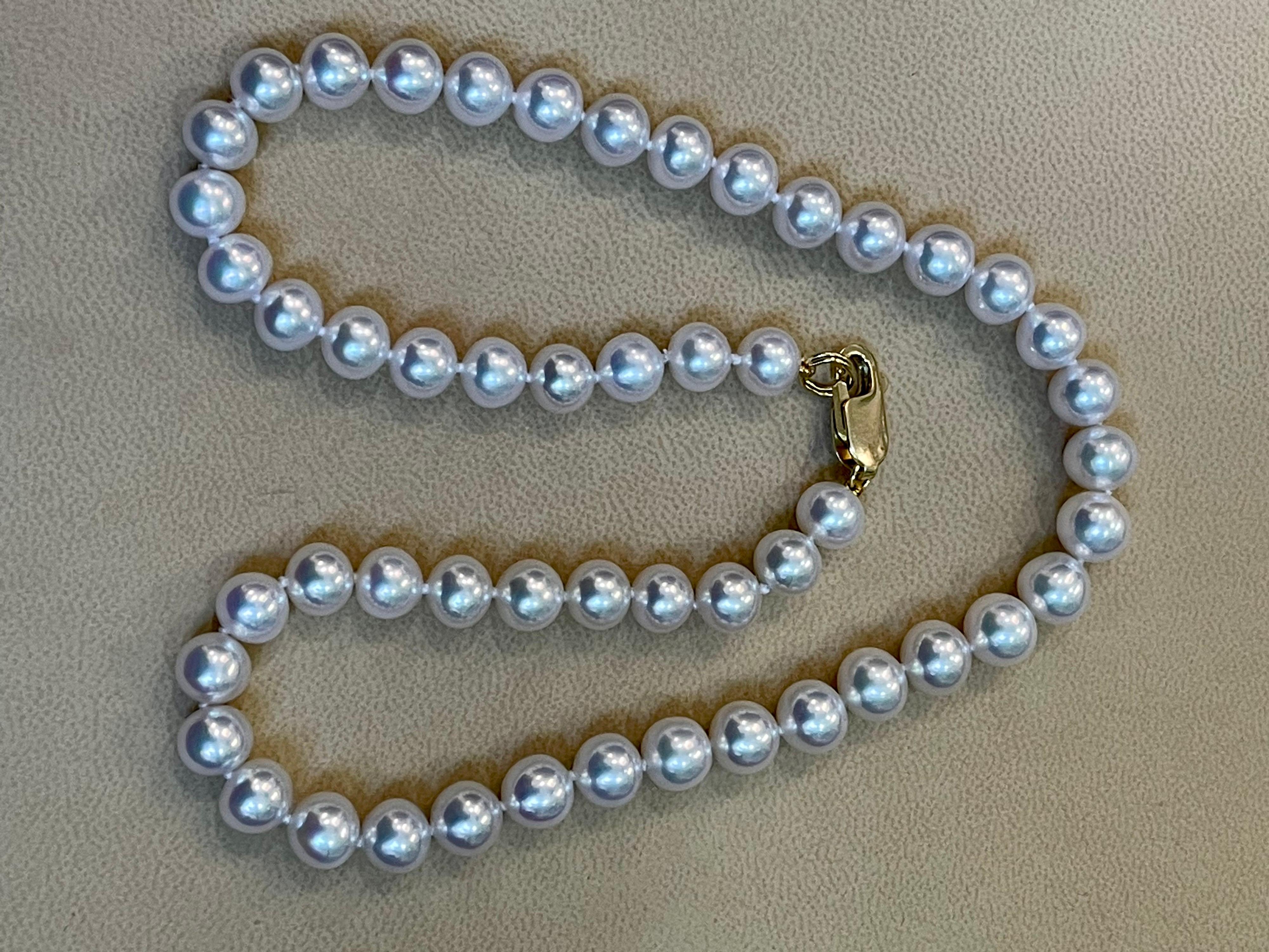 50 Round  8-9 MM Akoya Pearls Strand Necklace Set In 14 Karat Gold Clasp 17 Inch
8-9  mm Pearls  
14 Karat yellow gold  Lobster clasp
Estate piece 
Total weight of the necklace is  41.5 Grams
length of the necklace is 16 inch to 17 inch
Luster of