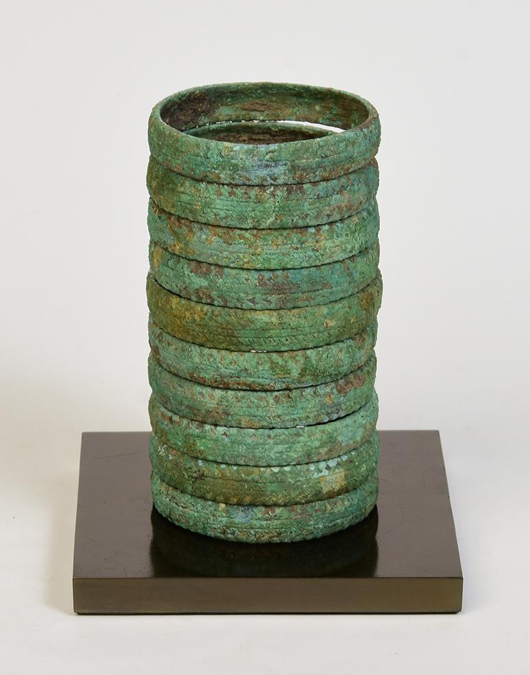 A set of Dong Son bronze bracelets with very nice green patina.

Age: Cambodia, Dong Son Period, 500 B.C.
Size: Diameter 7 C.M. / Height 12.5 C.M.
Condition: Nice condition overall (some expected degradation due to their age).

100% satisfaction and