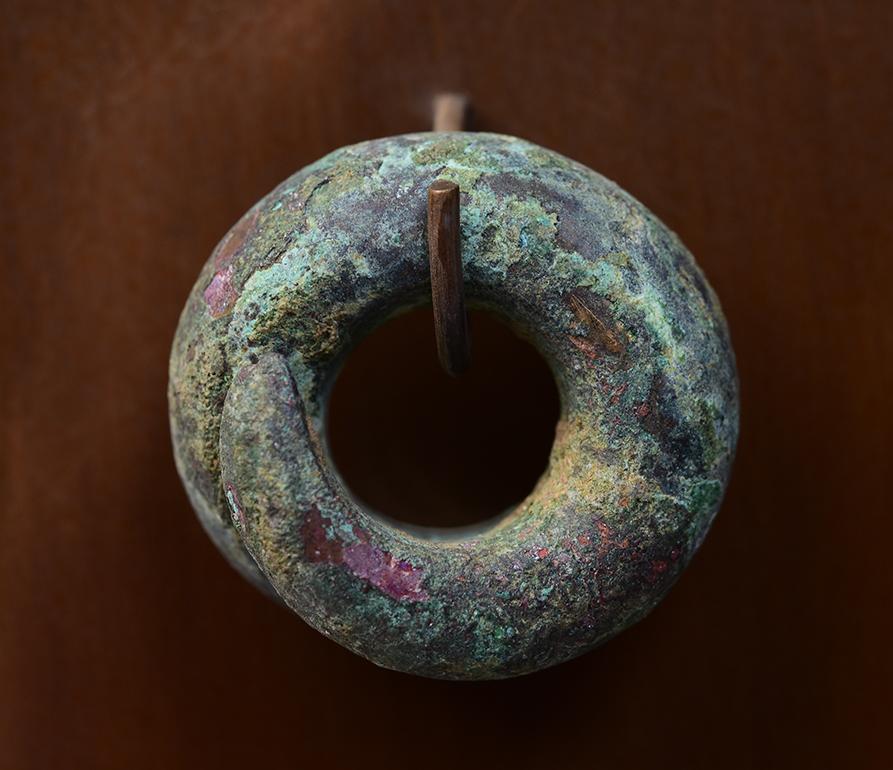 A set of Antique Khmer bronze earrings with very nice green patina.

Age: Cambodia, Dong Son Period, 500 B.C.
Size of each earring: Diameter 2.8 - 3.5 C.M.
Size of stand: Height 38.5 C.M. / Width 15 C.M.
Condition: Nice condition overall (some