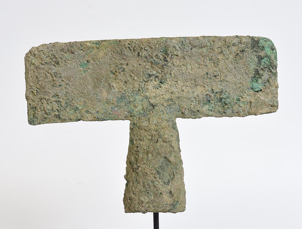 Dong Son bronze axe with very nice green patina.

Age: Cambodia, Dong Son Period, 500 B.C.
Size: Height 14.5 C.M. / Width 20.9 C.M. / Thickness 3.1 C.M.
Size including stand: Height 23.4 C.M.
Condition: Nice condition overall (some expected