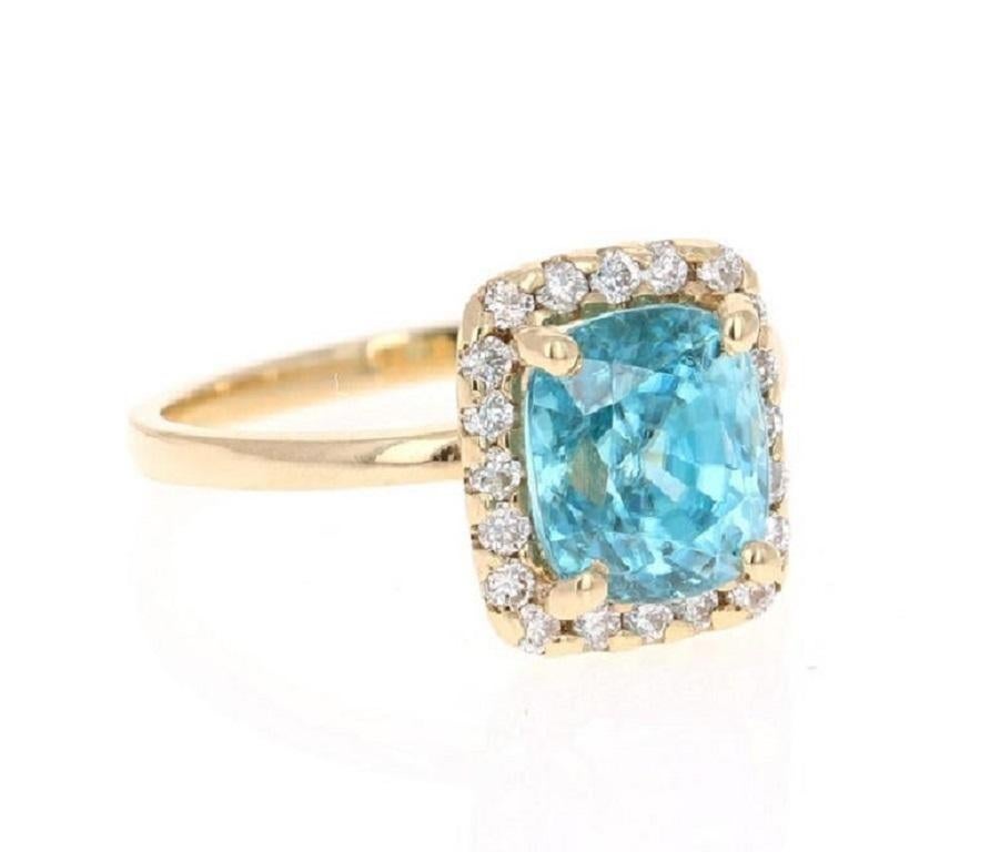 A beautiful Blue Zircon and Diamond ring that can be a nice Engagement ring or just an everyday ring!

Blue Zircon is a natural stone mined mainly in Sri Lanka, Myanmar, and Australia.  

This ring has a beautiful Cushion Cut Blue Zircon that weighs