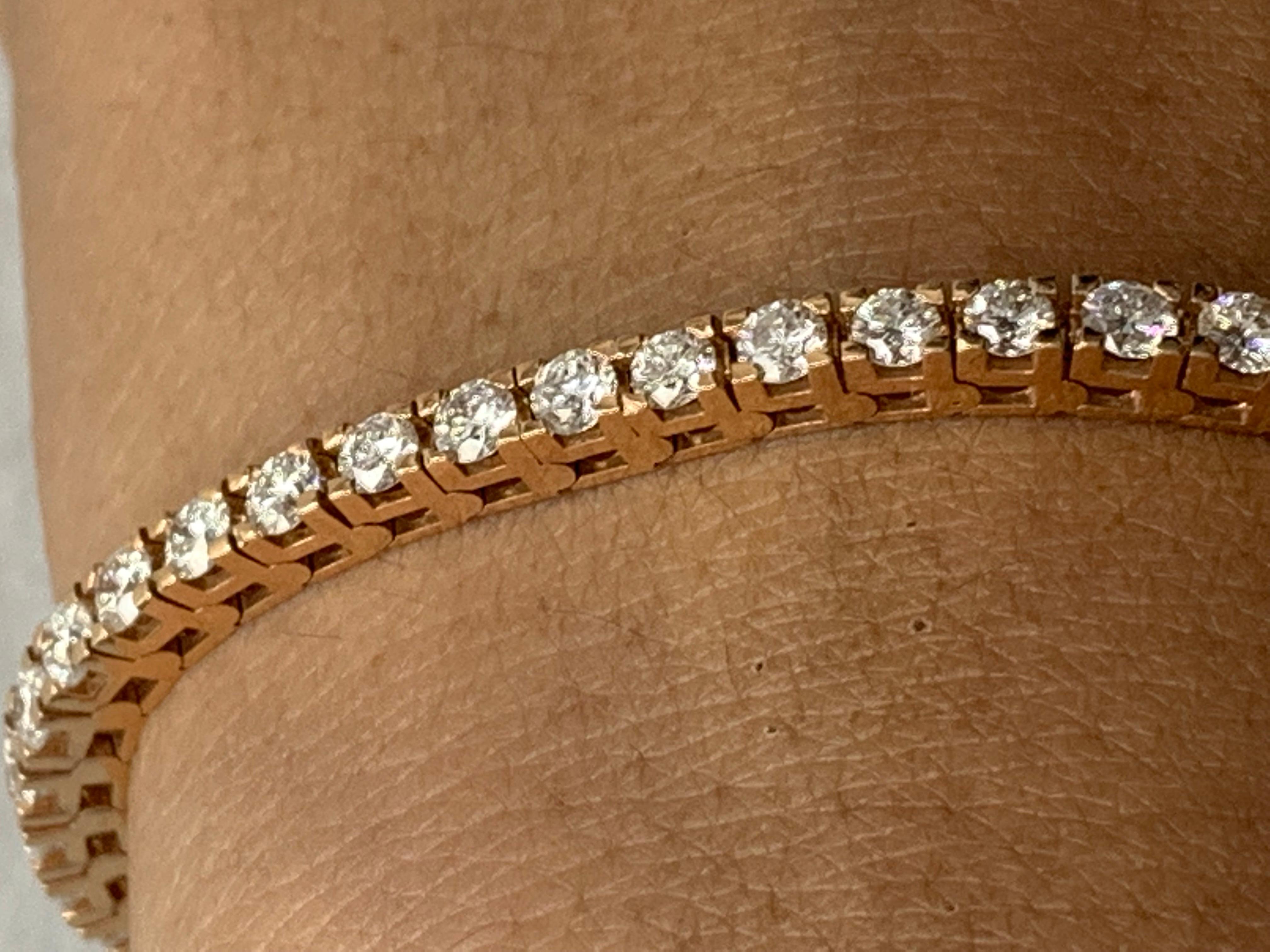 A classic tennis bracelet style showcasing a row of round brilliant diamonds, set in a polished 14k rose gold mounting. 50 Diamonds weigh 5.00 carats total and are approximately GH color, SI1 clarity.

Style is available in different price ranges.