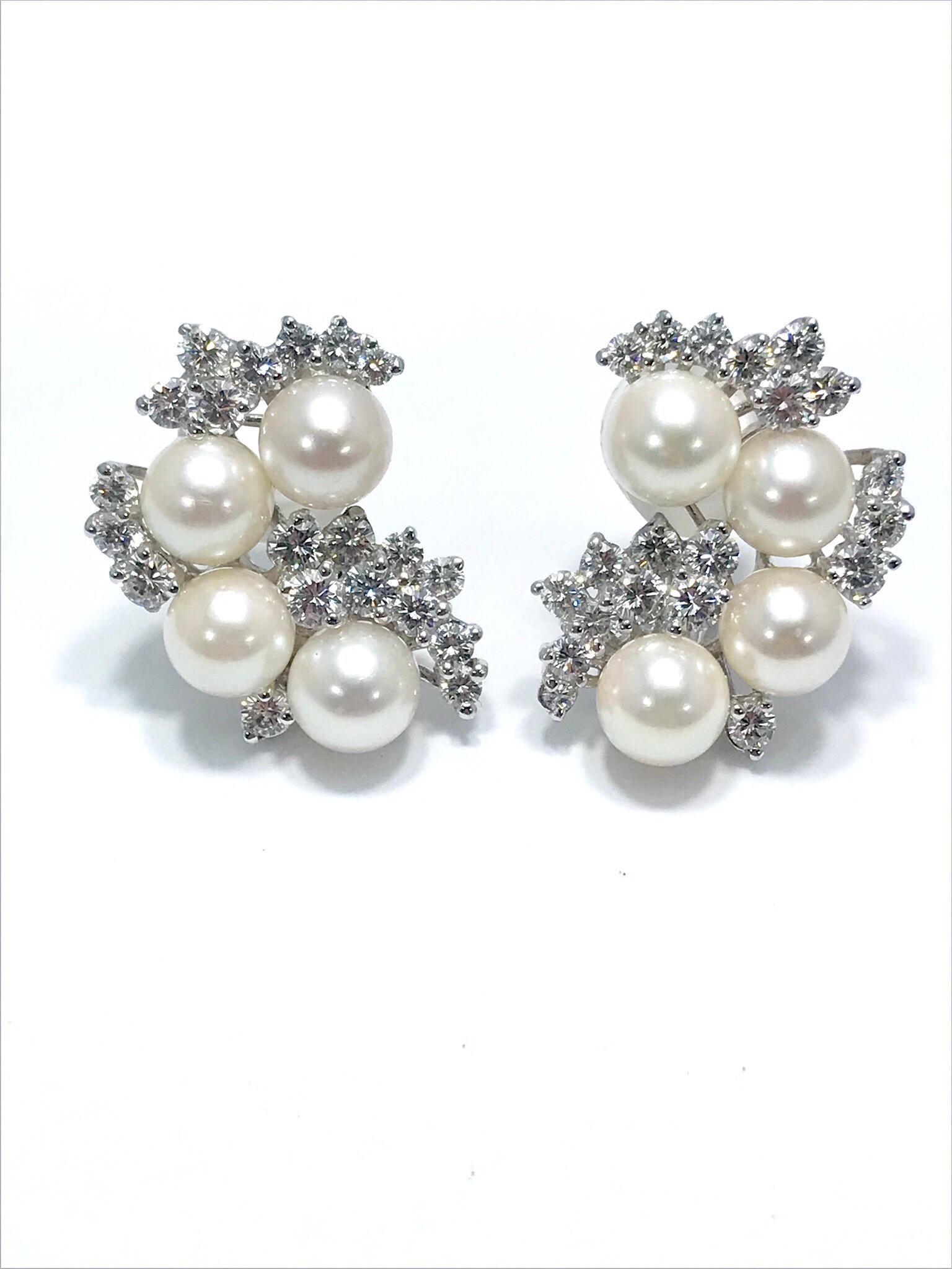 A very elegant 5.00 carat Diamond and Cultured Pearl platinum clip earrings.  The Diamonds are very fine modern round brilliant cuts, F/G color, VS clarity.  The Cultured Pearls measure 7.00 - 7.50 millimeters and have a beautiful luster.  The