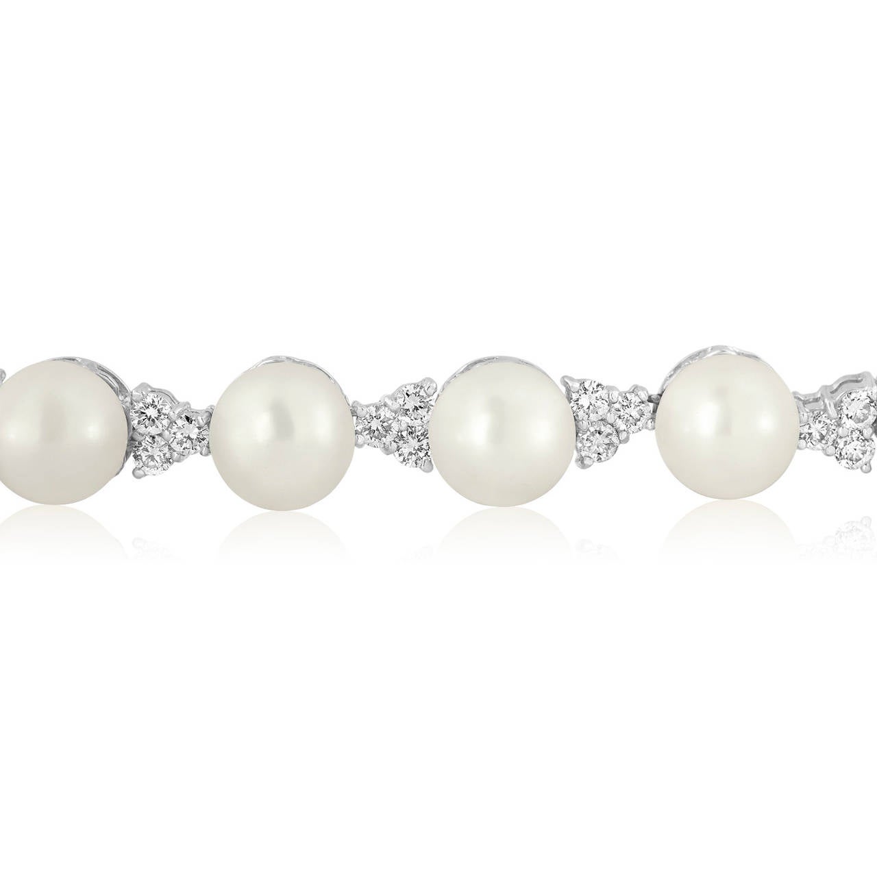 Stunning Pearl Necklace.
The necklace is 18K white gold
There are 35 7.5-8.00 mm cultured pearls
There are 5.00 Carats In Diamonds F/G VS/SI.
The necklace is 17