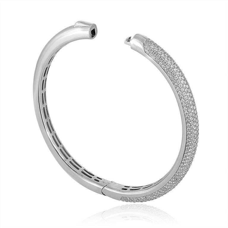 Classic Bangle Bracelet
The bangle is 14K White Gold
There are 5.00 Carats In Diamonds F/G VS/SI
The bangle weighs 28.4 grams
The bangle is 0.25