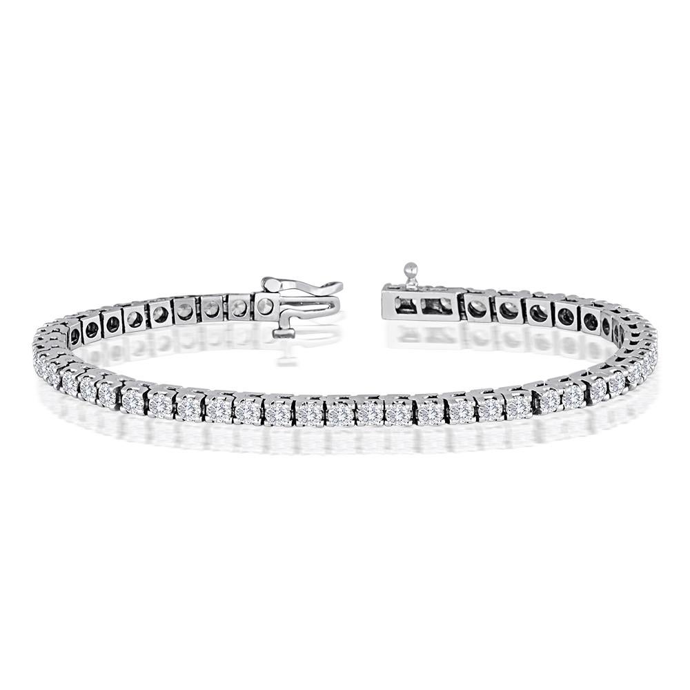 Sparkling Diamond Tennis Bracelet
The Bracelet is 14K White Gold.
There are 5.00 Carats in Diamonds F/G VS/SI
This is a 4 prong setting.
The bracelet is 7″ in length.
There are 50 stones.
Each diamond is about 0.10 Carat
The bracelet weighs 16.5