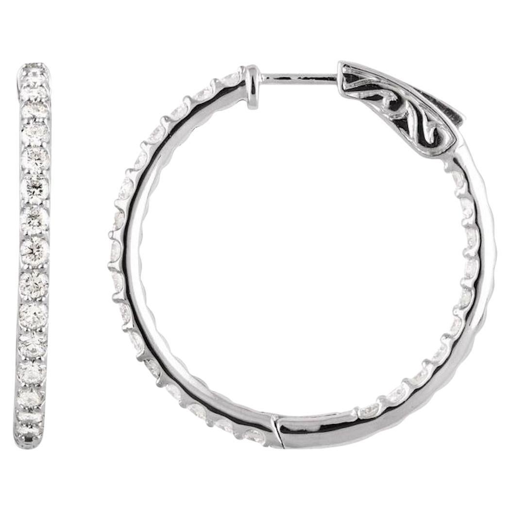 Choose Yellow, Pink, or White Gold!
Quality diamond hoops made especially with a hinged post closure. The diamonds are pave set inside and outside of the diamonds hoop of excellent workmanship.
 Let us know what color metal you what to