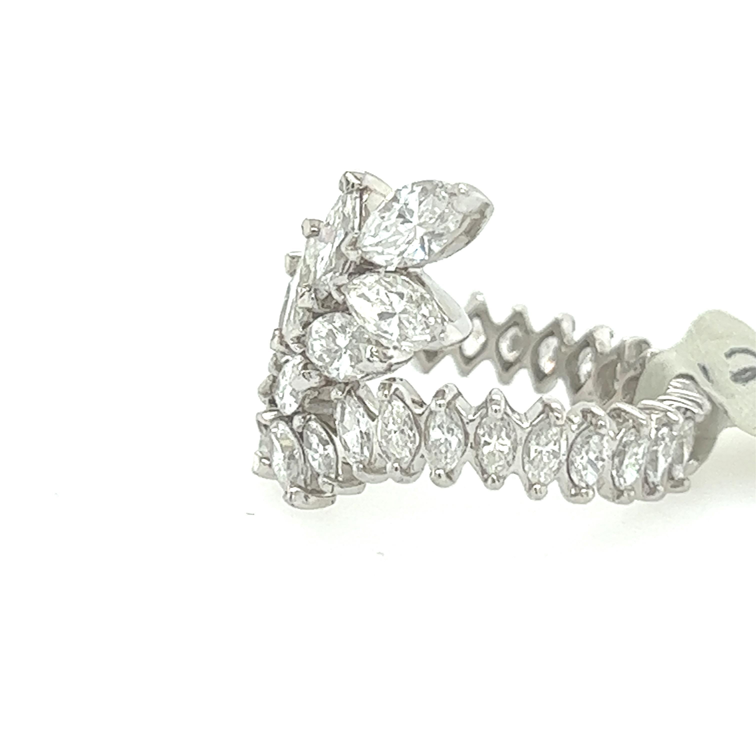 This exquisite 5.00 Carat Marquise Diamond Eternity Band is a stunning example of vintage jewelry from the mid-twentieth century. Crafted in luxurious platinum, the band features a continuous row of marquise-cut diamonds that sparkle and shine from