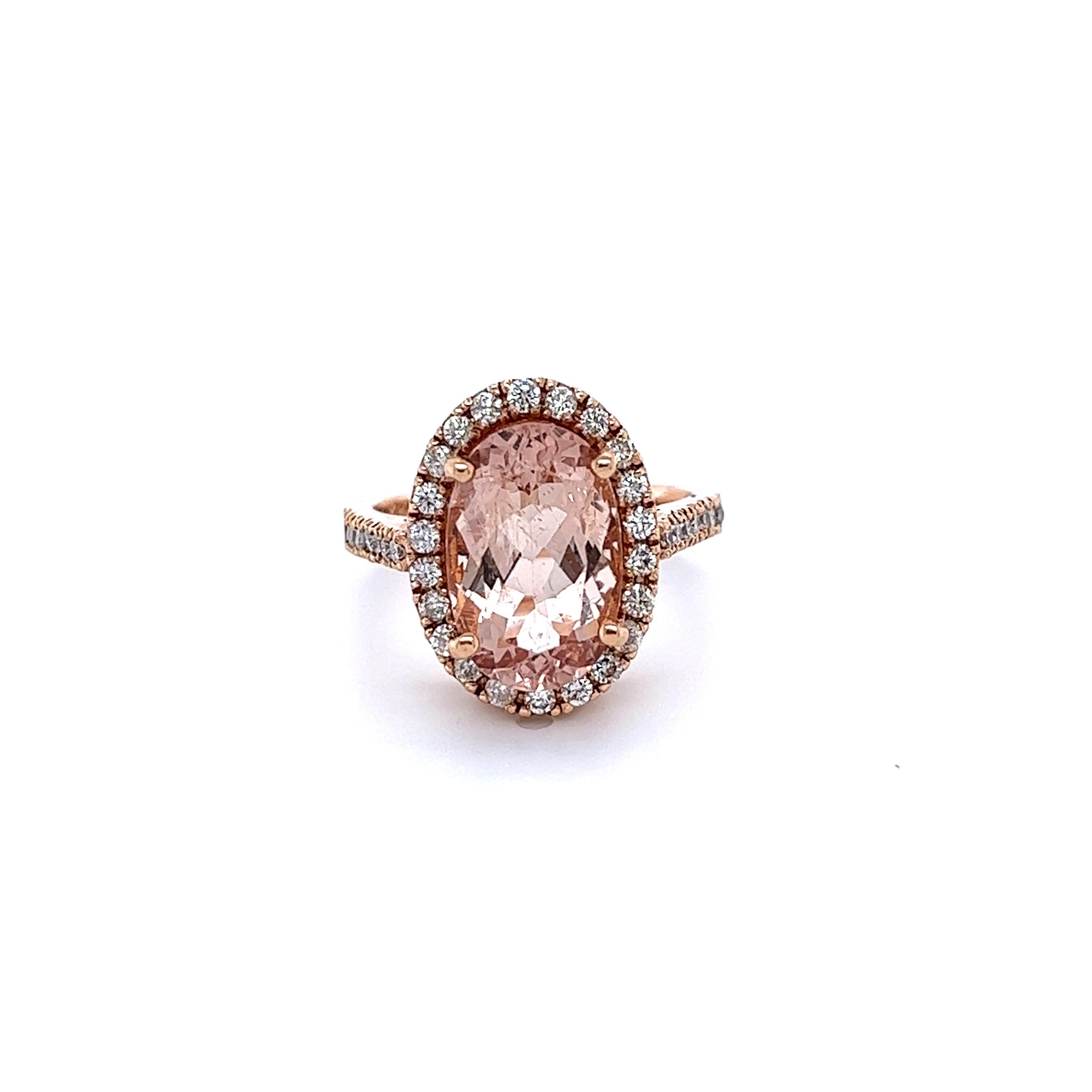 
This Morganite Diamond Ring has a 4.39 Carat Oval Cut Peach Morganite and is surrounded by 36 Round Cut Diamonds that weigh 0.61 carats. (Clarity: SI, Color: F) The Total Carat Weight of the ring is 5.00 Carats.  

The morganite measures at