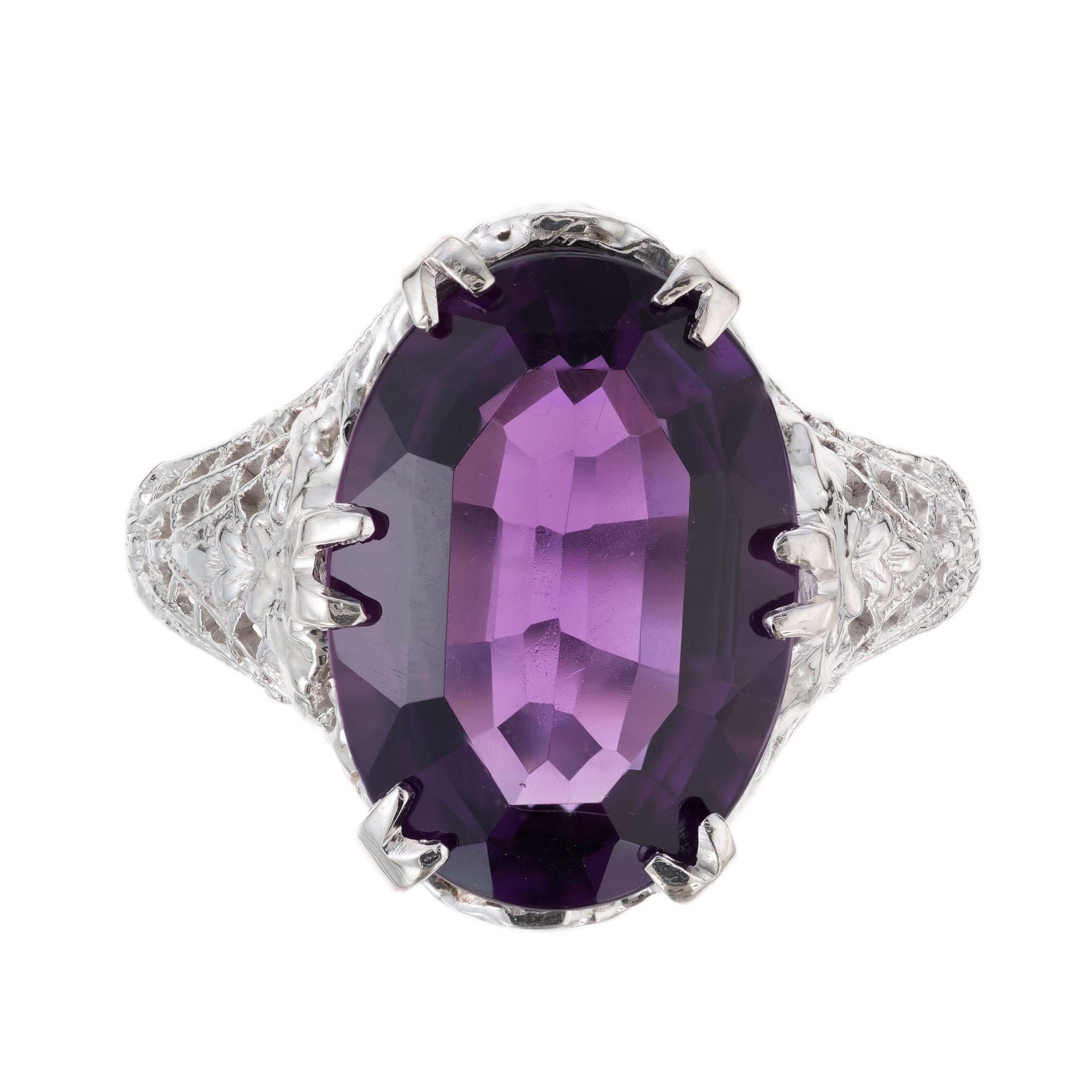 Oval purple Amethyst set in a Filigree pierced 14k white gold 12 prong setting. circa 1930's

1 oval bright purple Amethyst, approx. total weight 5.00cts, VS
Size 6 and sizable
3.9 grams
Tested: 14k
Stamped: Not
14k White Gold
Width at top: