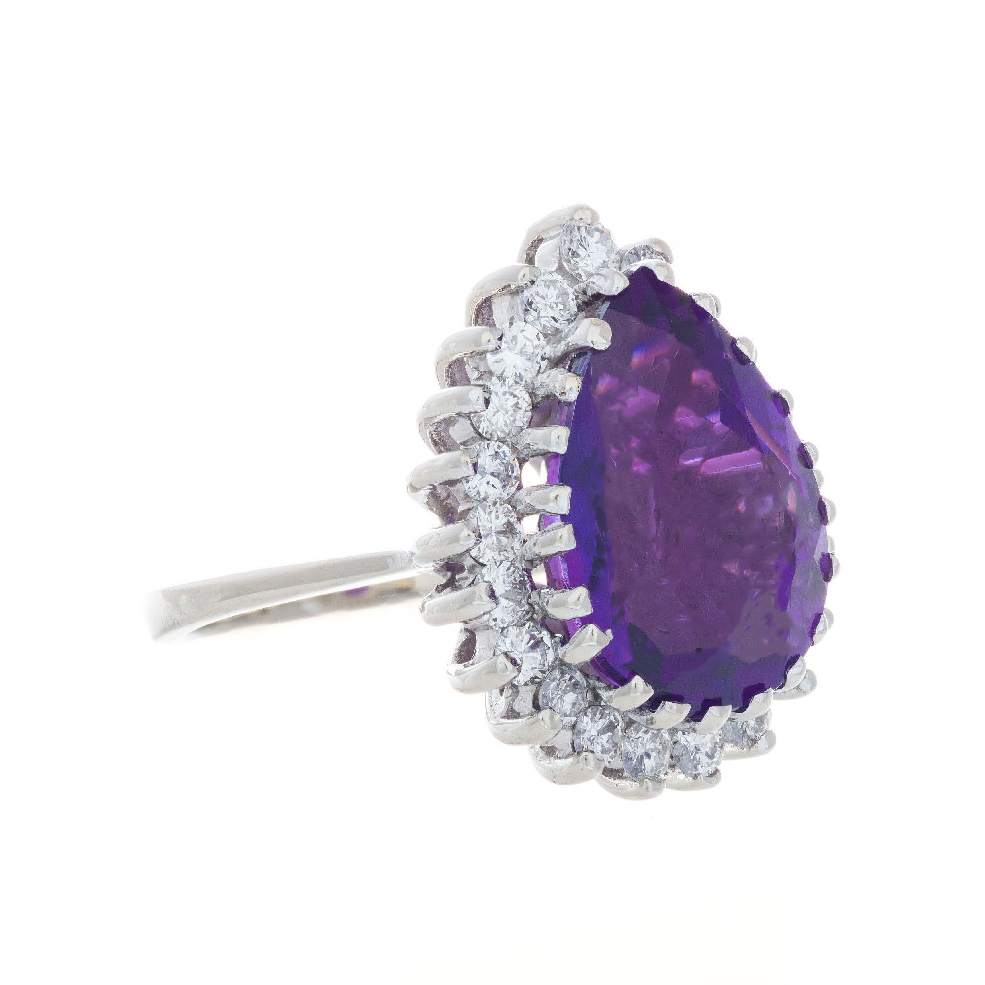 1950's pear shaped amethyst with a halo of 21 round brilliant cut diamonds in a custom wire 14k white gold setting.  

1 pear shaped bright purple Amethyst, approx. total weight 5.00cts, VS, 15 x 11mm
21 round brilliant cut diamonds, approx. total