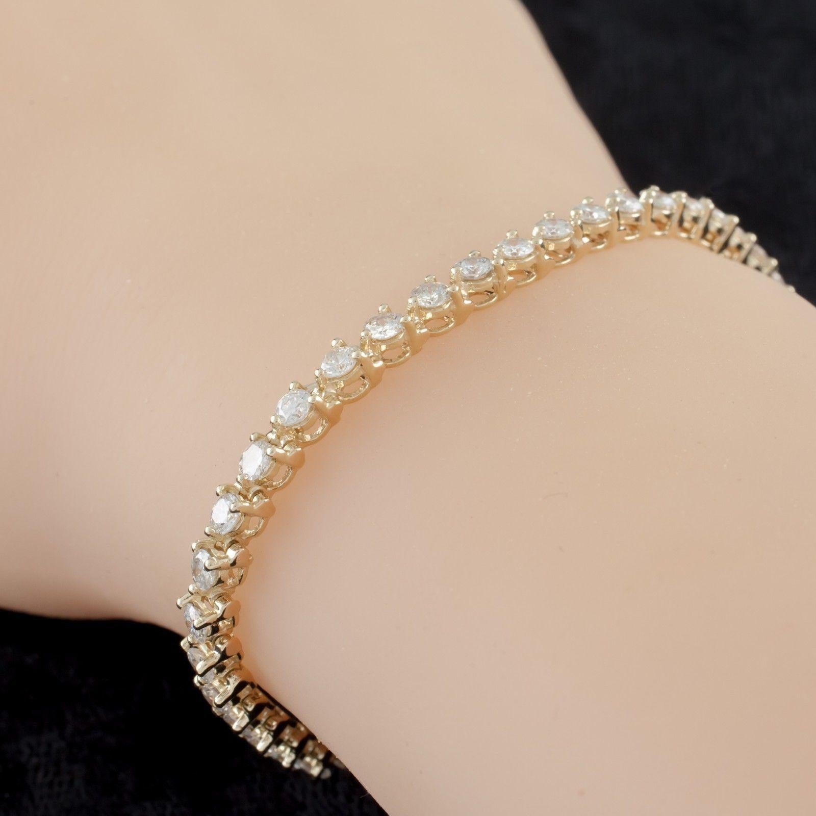 Gorgeous Three-Prong Setting Tennis Bracelet
14k Yellow Gold Setting
Total Diamond Weight = Approximately 5 carats
Total number of diamonds = 43
Average Color = G
Average Clarity = VS - SI
Total Mass = 9.65 grams
Approximately 7