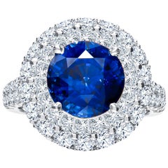 5.00 Carat Round Natural Blue Sapphire and 2.63 Carat Total Diamond Ring, 18K