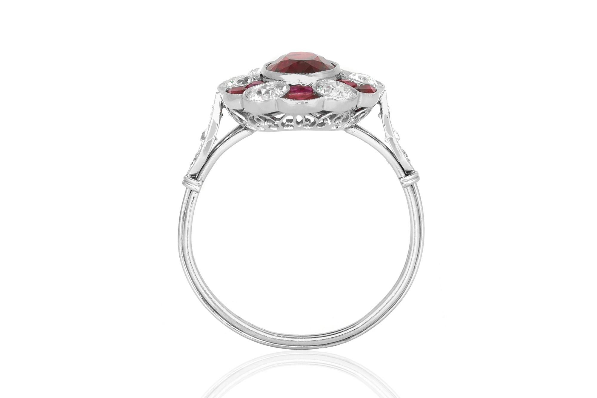 Estate ruby and diamond cluster flower ring finely crafted in platinum. Ring contains 5.00 carat of Rubies and 1.10 carat of Diamonds.  Circa 1970's.