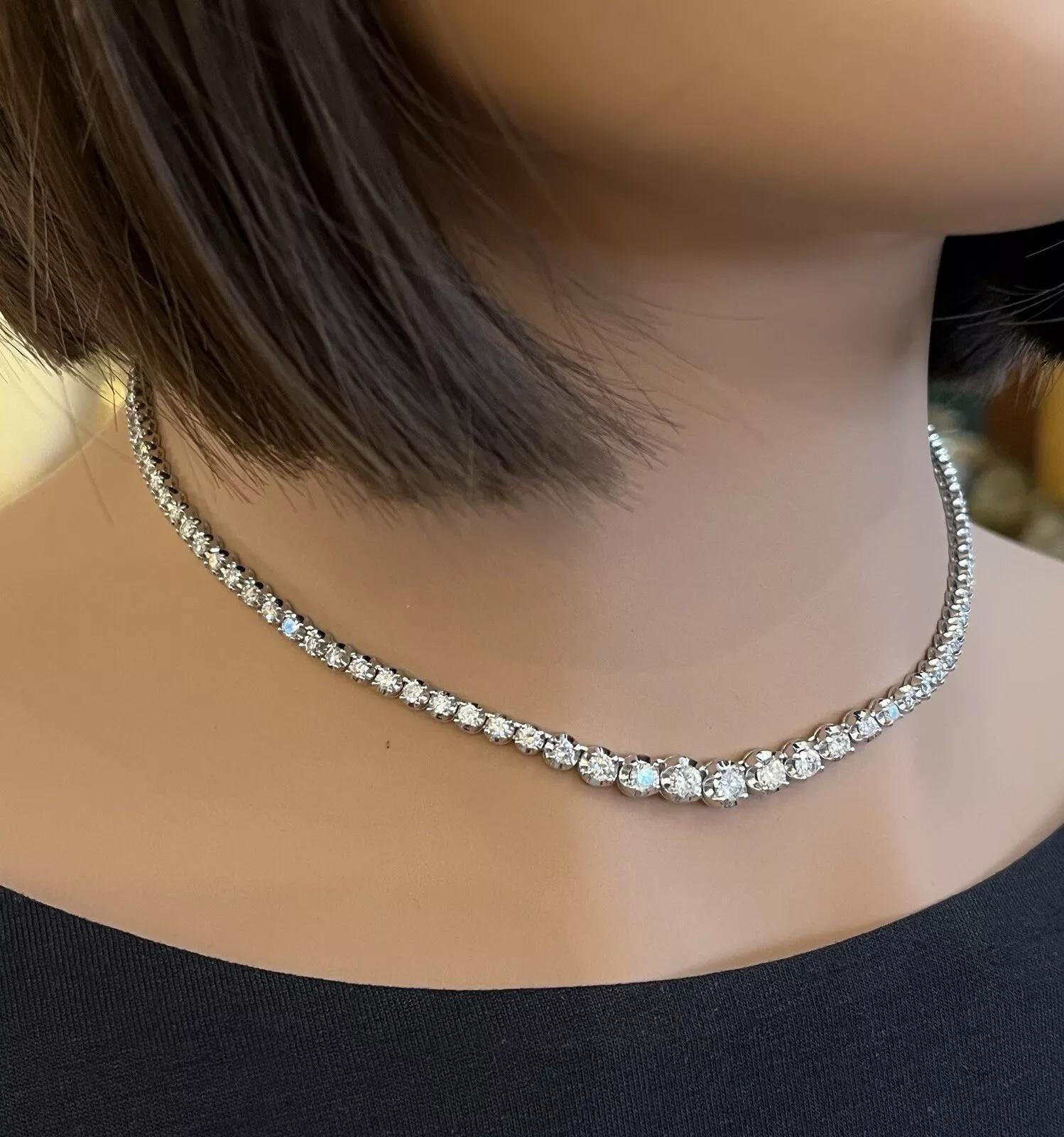5.00 Carat Total Weight Natural Diamond Graduated Tennis Necklace in Platinum

Diamond Tennis Necklace features Natural Round Brilliant Diamonds graduating in size and weighing 5.00 carats in total, all set in Platinum. The necklace is secured by a
