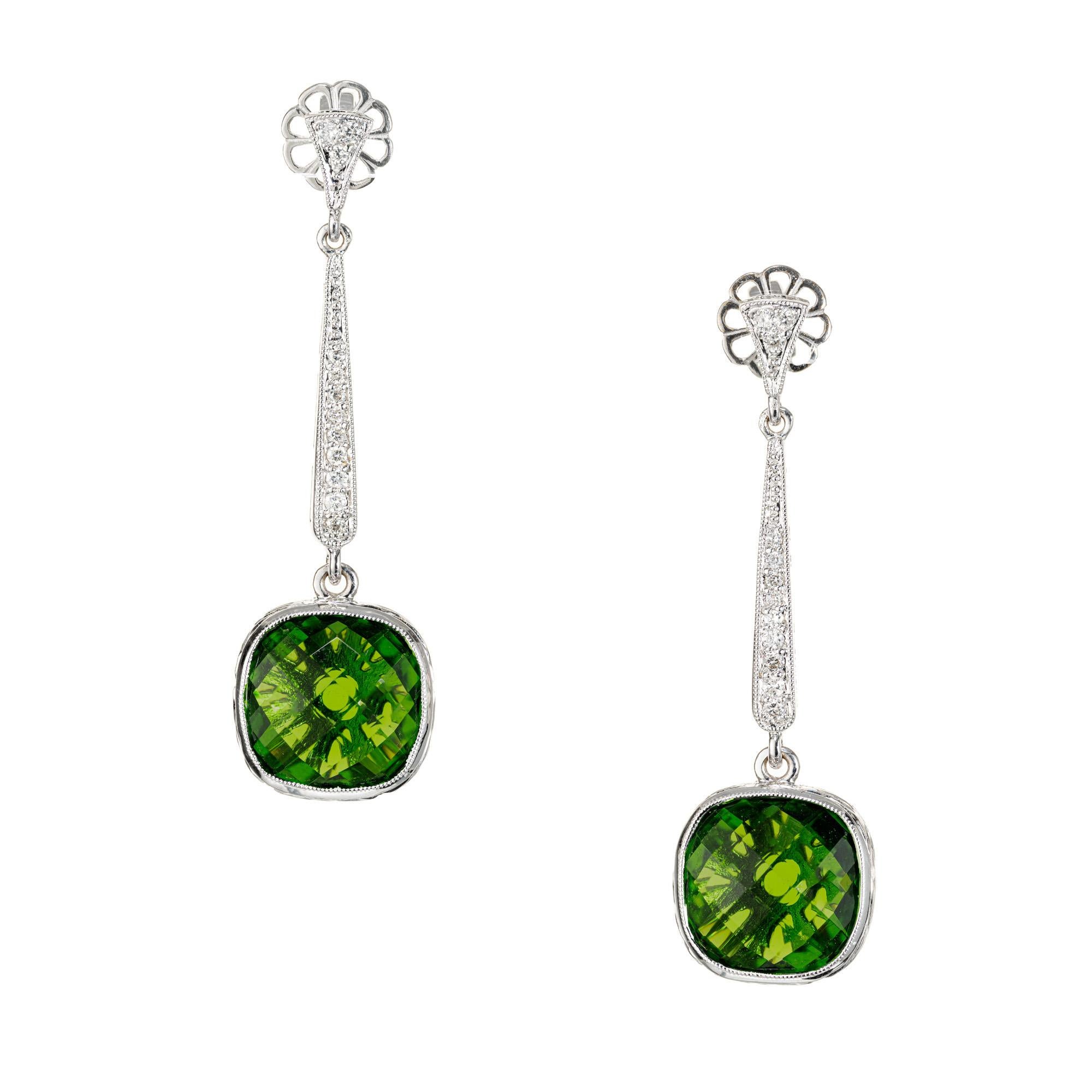 Tourmaline and diamond drop dangle earrings. 2 engraved bezel set cushion cut green tourmalines, set in 18k white gold with 24 round cut accent diamonds. 

2 cushion cut green tourmaline, approx. 5.00cts
24 round diamonds, I-J I approx. .16cts
18k