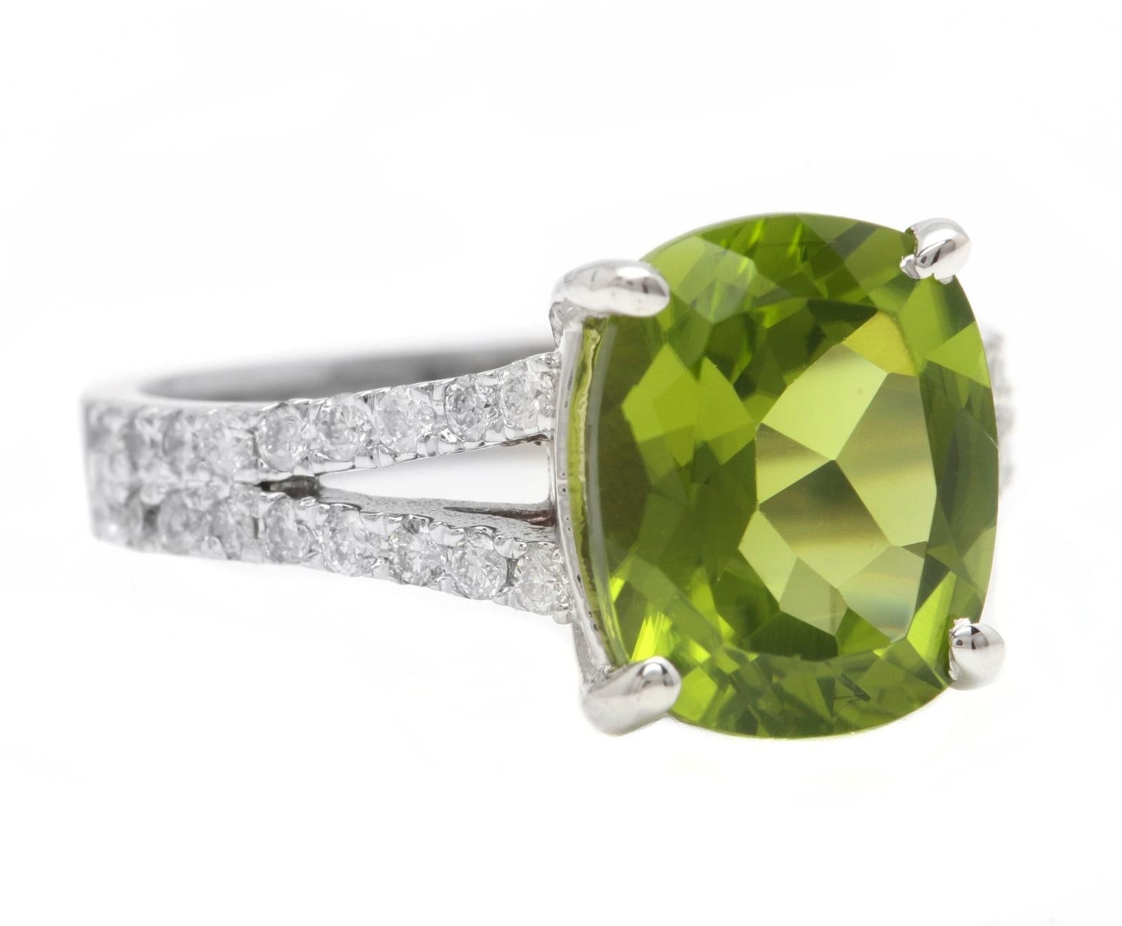 5.00 Carats Natural Very Nice Looking Peridot and Diamond 14K Solid White Gold Ring

Suggested Replacement Value:  $5,000.00

Total Natural Cushion Peridot Weight is: Approx. 4.50 Carats 

Peridot Measures: Approx. 11 x 9mm

Natural Round Diamonds